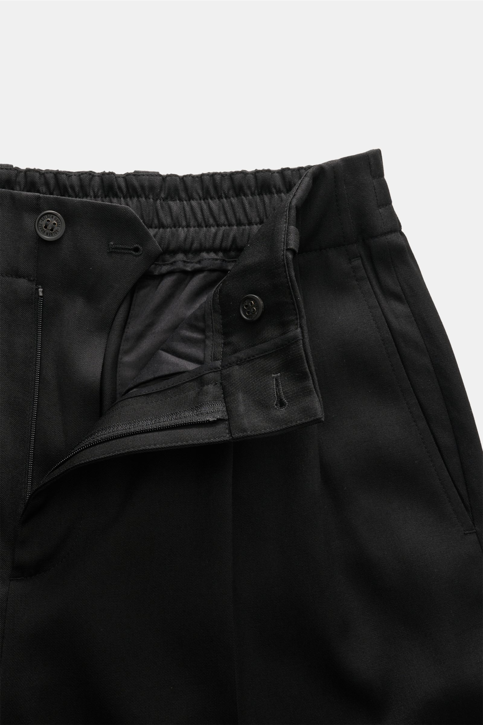 Golden Goose Wool trousers black shown from close-up front angle, highlighting double pleat, zip, button, elasticated waistband.