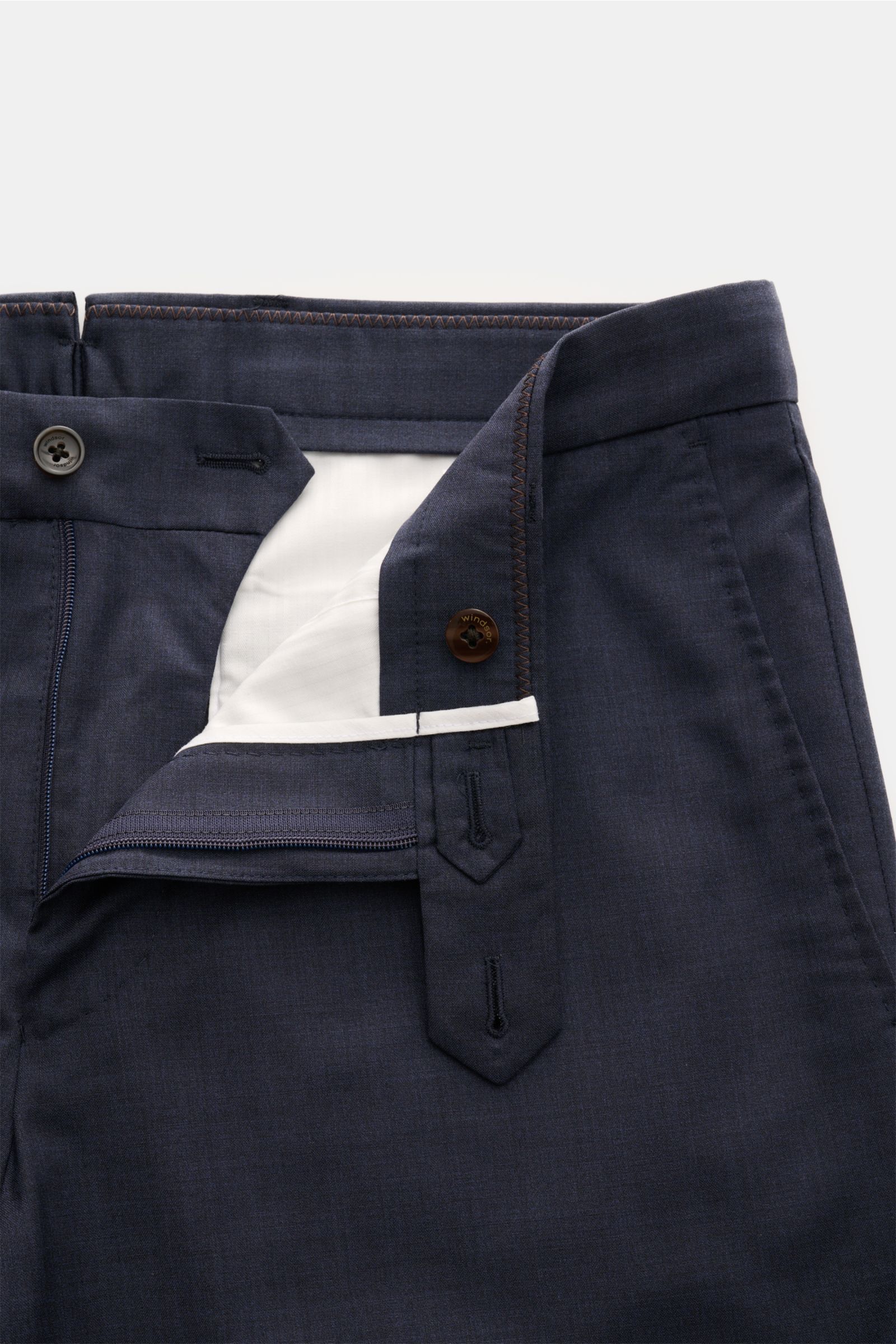 Windsor Wool trousers 'Peso' navy mottled shown from above with open zip and button closure, smooth virgin wool fabric, regular fit, tapered cut, French and jetted back pockets. For a confident look: The model 'Peso' in the finest virgin wool by WINDSOR i