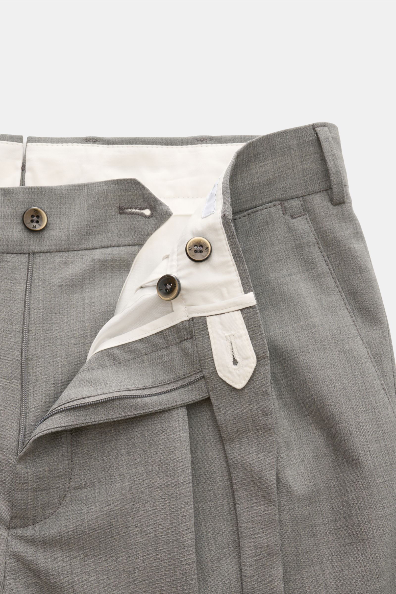 Close-up front view of PT Torino Wool trousers 'Carrot Fit' grey mottled showing short cut, double pleats, extended buttoned tab, and zip closure. Classic elegance with a modern twist: With their short cut, stylish pleats and extended buttoned tab, the tr