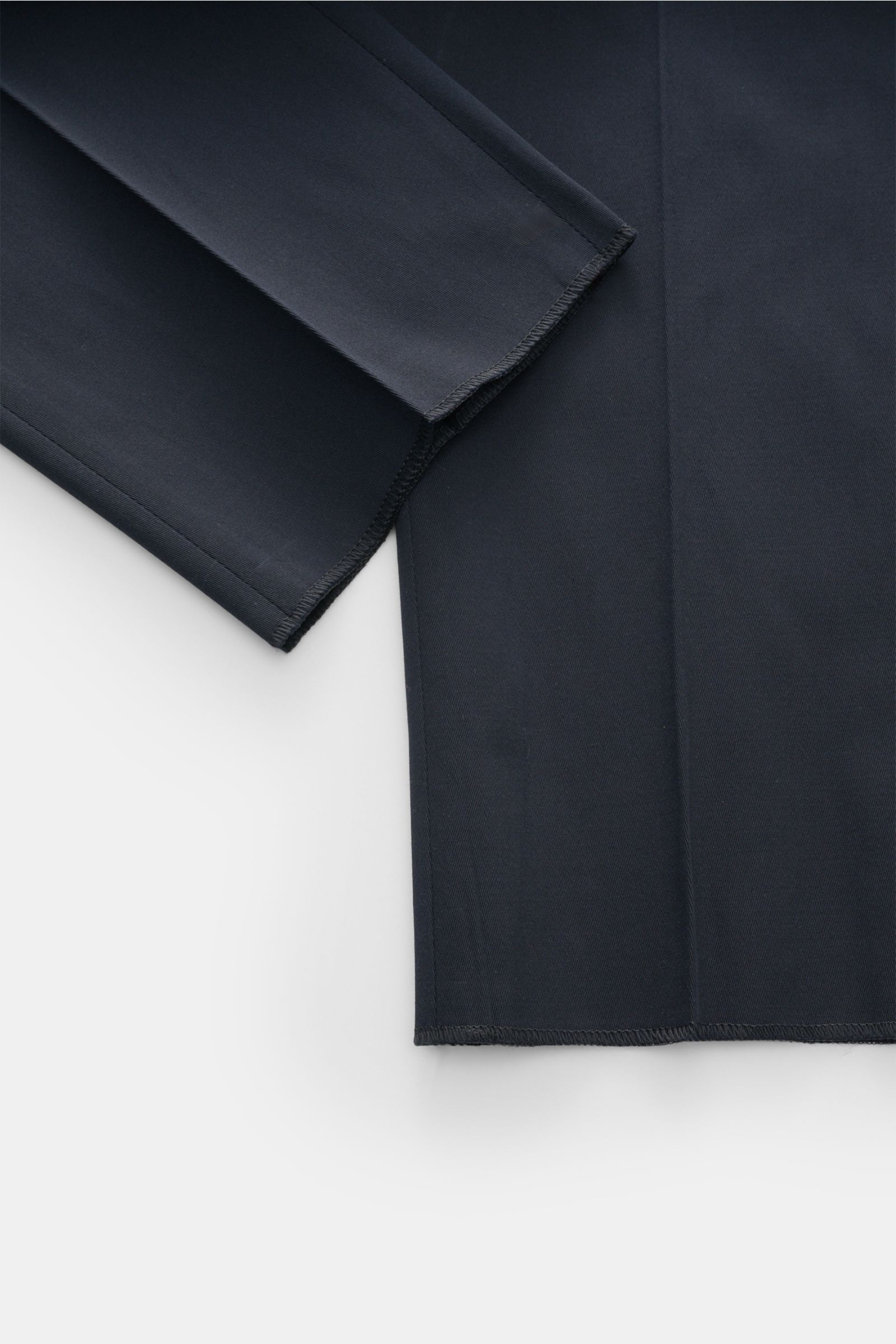 Close-up top-down view of PT Torino Chinos 'Union Fit' dark navy showing fine cotton-silk twill fabric with slight stretch and tapered cut hem.