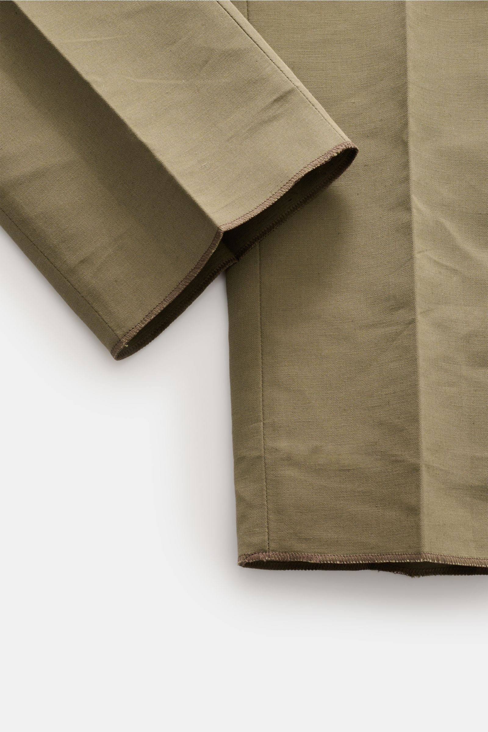 Close-up, top-down view of PT Torino Trousers 'Gentleman Fit' taupe showing hem and fabric texture in linen-cotton blend, slim tapered fit.

Description for context:
For these exclusive 'Gentleman Fit' trousers, PT TORINO has chosen a summery blend of 
