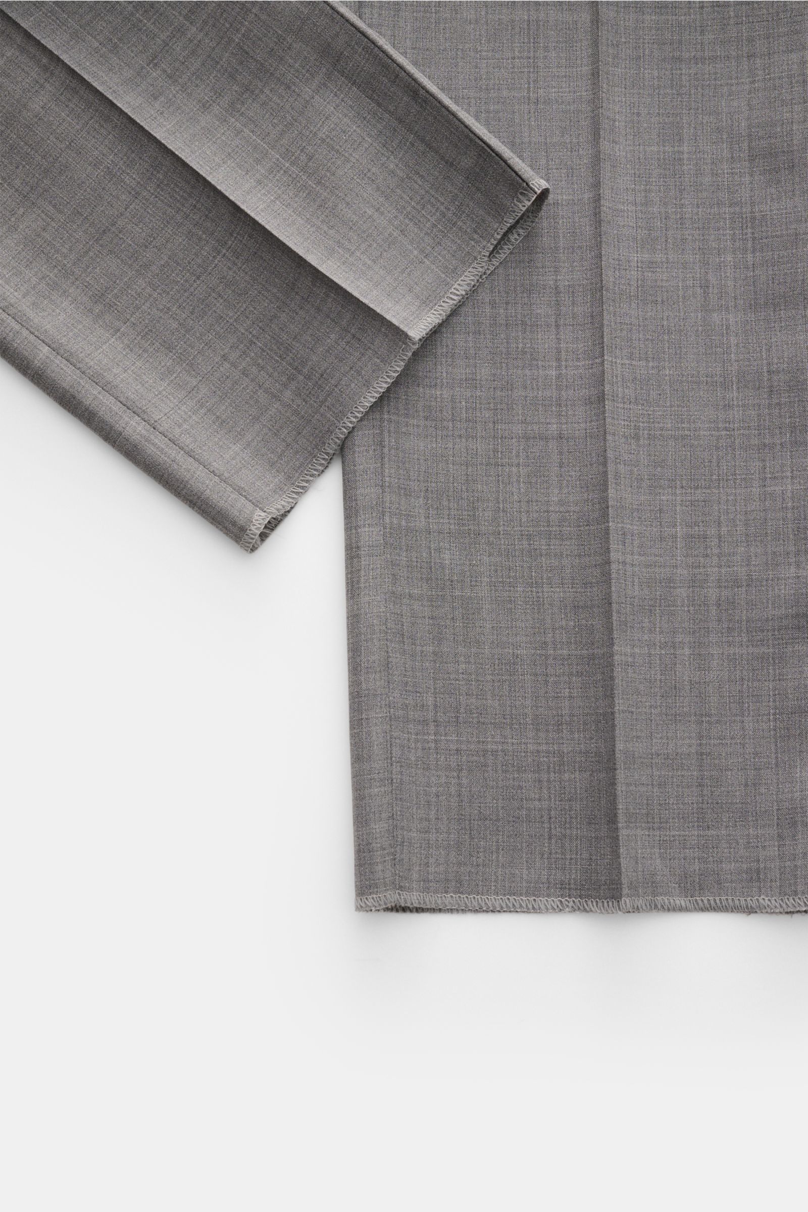 PT Torino Wool trousers 'Gentleman Fit' grey mottled shown from above, highlighting fabric texture and hems. For the exclusive trousers 'Gentleman Fit', PT TORINO has chosen virgin wool in lightweight Super 130'S fabric – a perfect all-round model for you