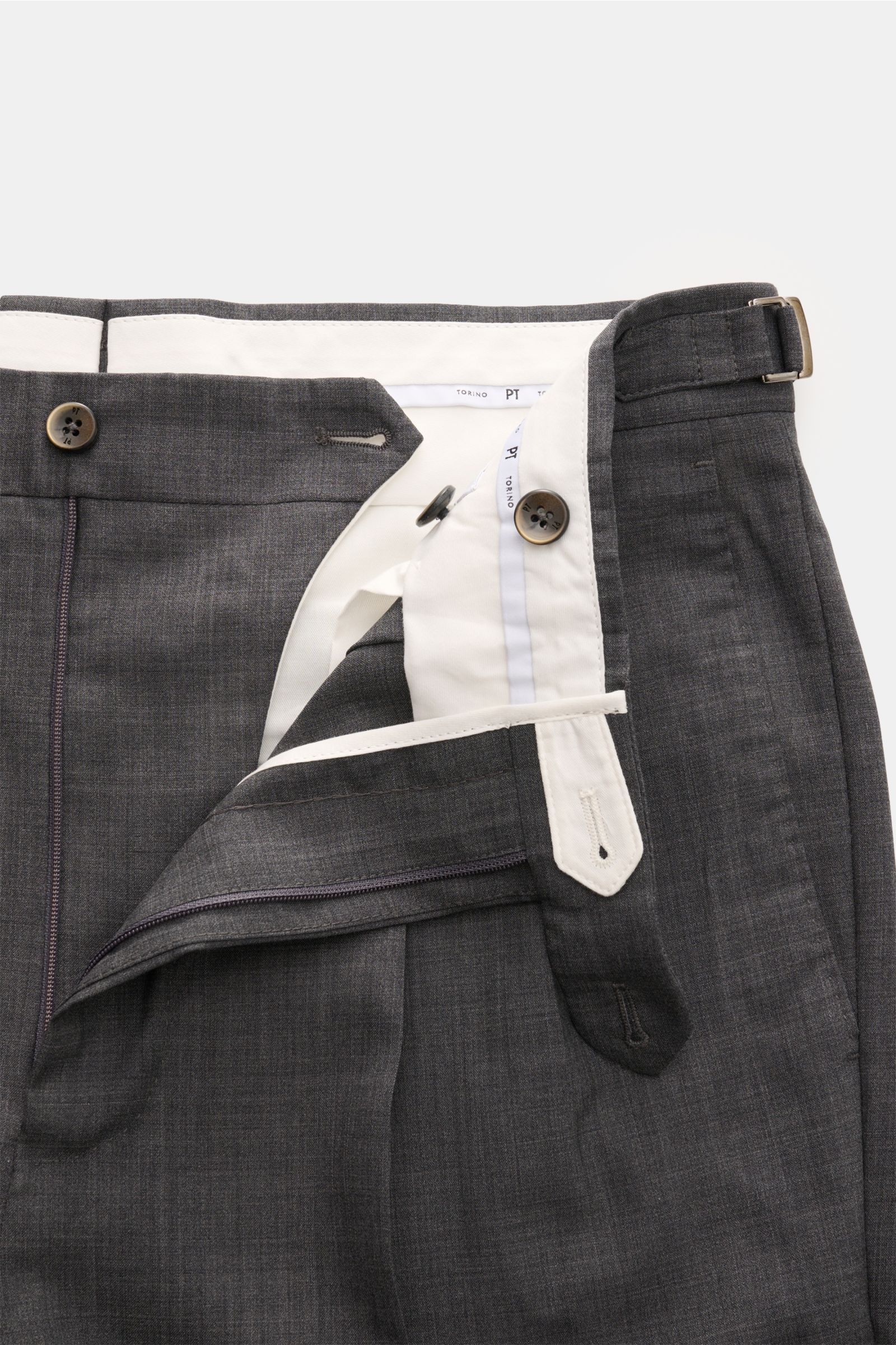 PT Torino Wool trousers 'Gentleman Fit' dark grey mottled shown from a top-front close-up with open zipper, buttons, and side adjuster visible. For the exclusive trousers 'Gentleman Fit', PT TORINO has chosen virgin wool in lightweight Super 130'S fabric 