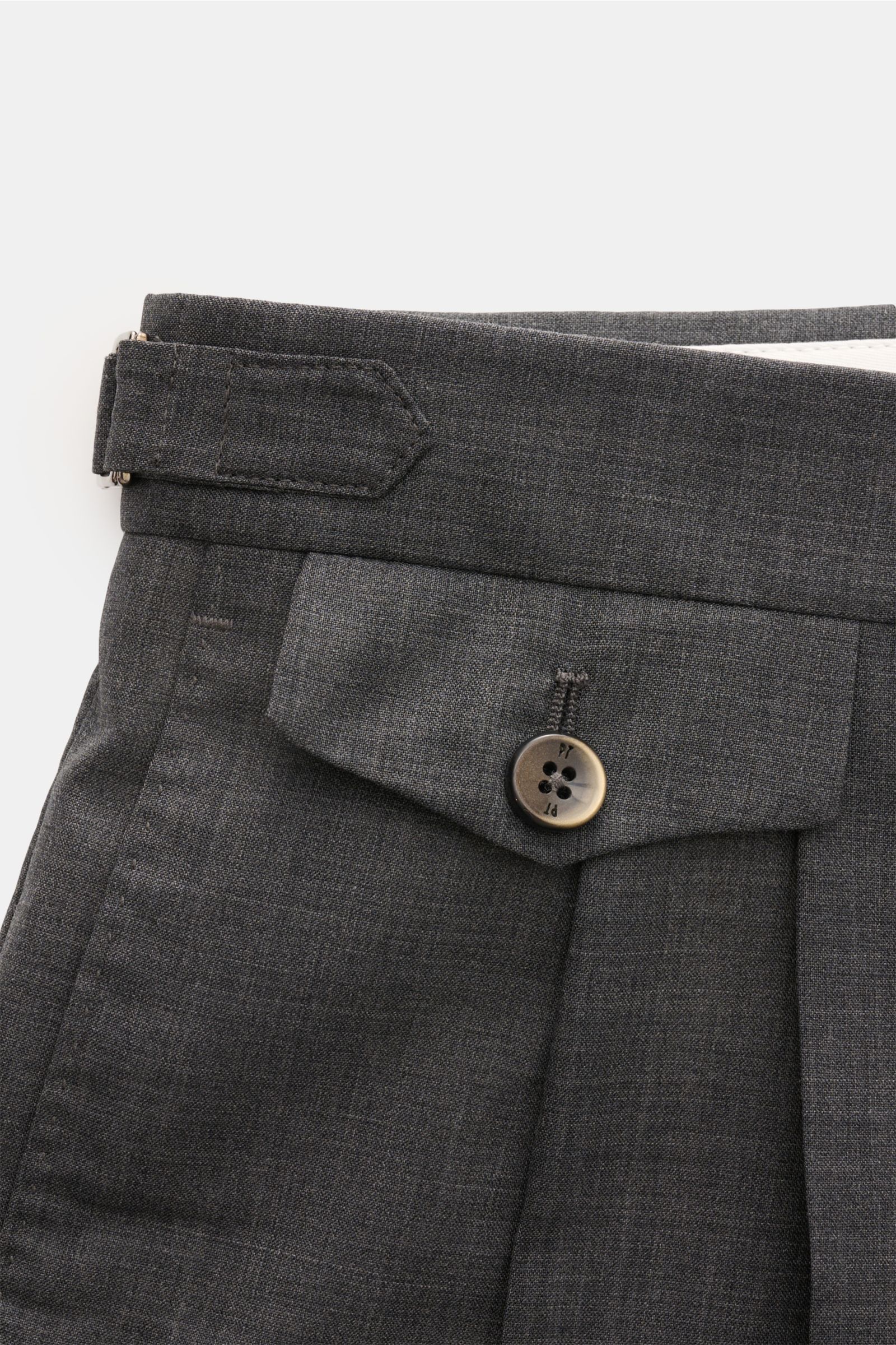 Close-up view from above of the waistband and upper front section of PT Torino Wool trousers 'Gentleman Fit' dark grey mottled, showing side adjuster, double pleat, and buttoned watch pocket flap, made of pure Super 130'S virgin wool, soft feel, lightweig