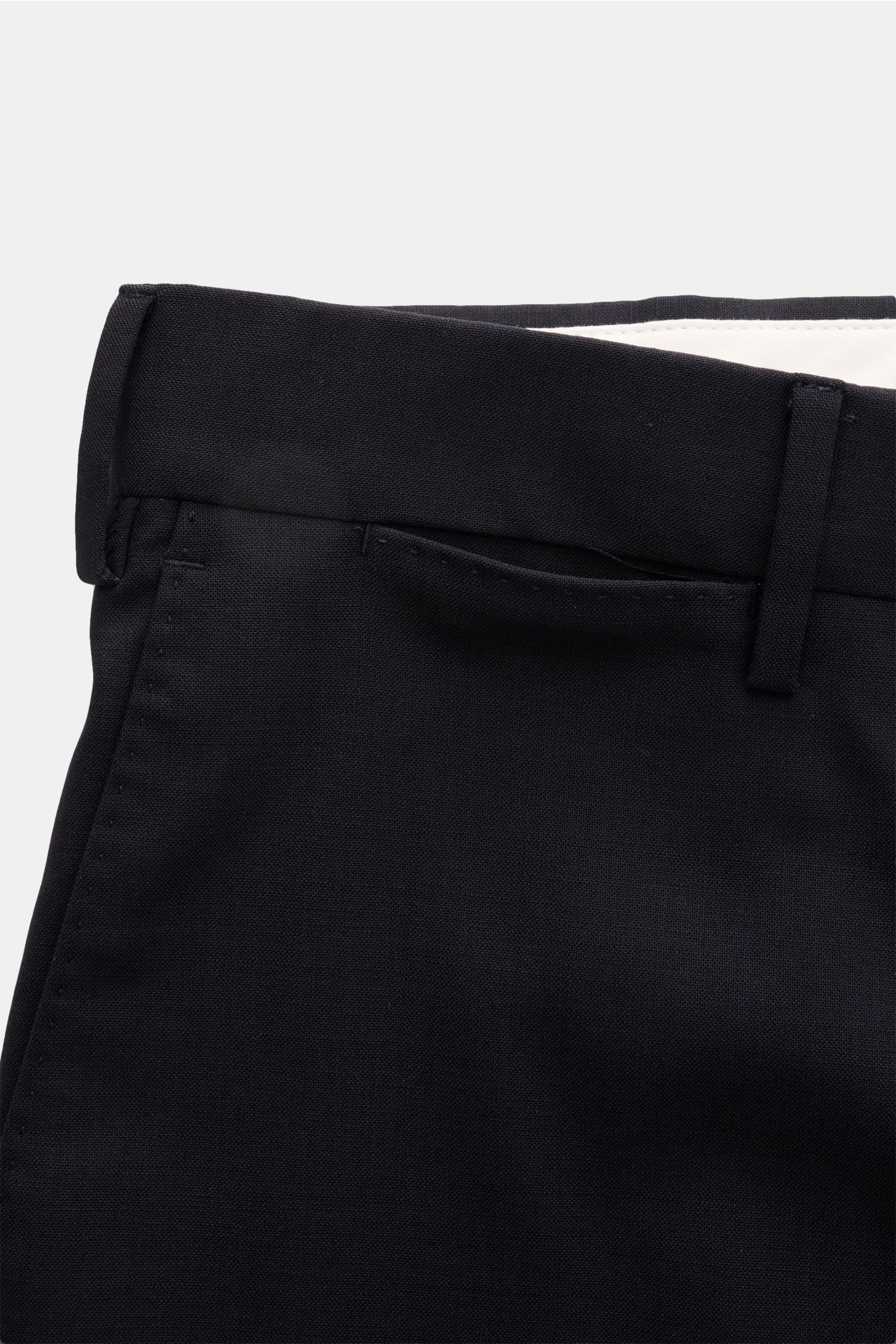 Close-up front view of PT Torino Wool trousers 'Slim Fit' navy showing elastic virgin wool fabric, slim tapered cut, French pockets, zip and waist buttons.

Description: For these exclusive trousers, PT TORINO has chosen the finest virgin wool that emp