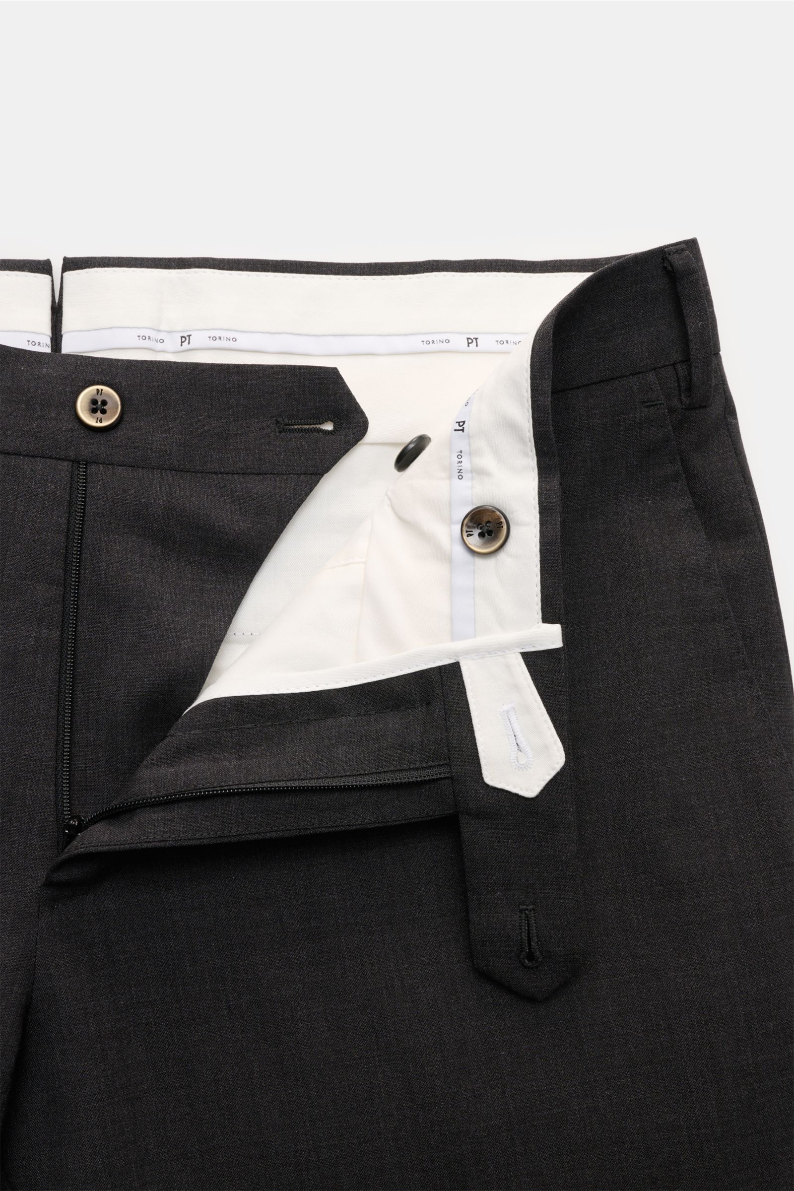 Close-up top-front view of the PT Torino Wollhose 'Slim Fit' anthrazit showing the high-end slim-fit trousers made of elastic, smooth fine virgin wool with zipper, button closure, French pockets, watch pocket, and welted back pockets with buttons, perfect