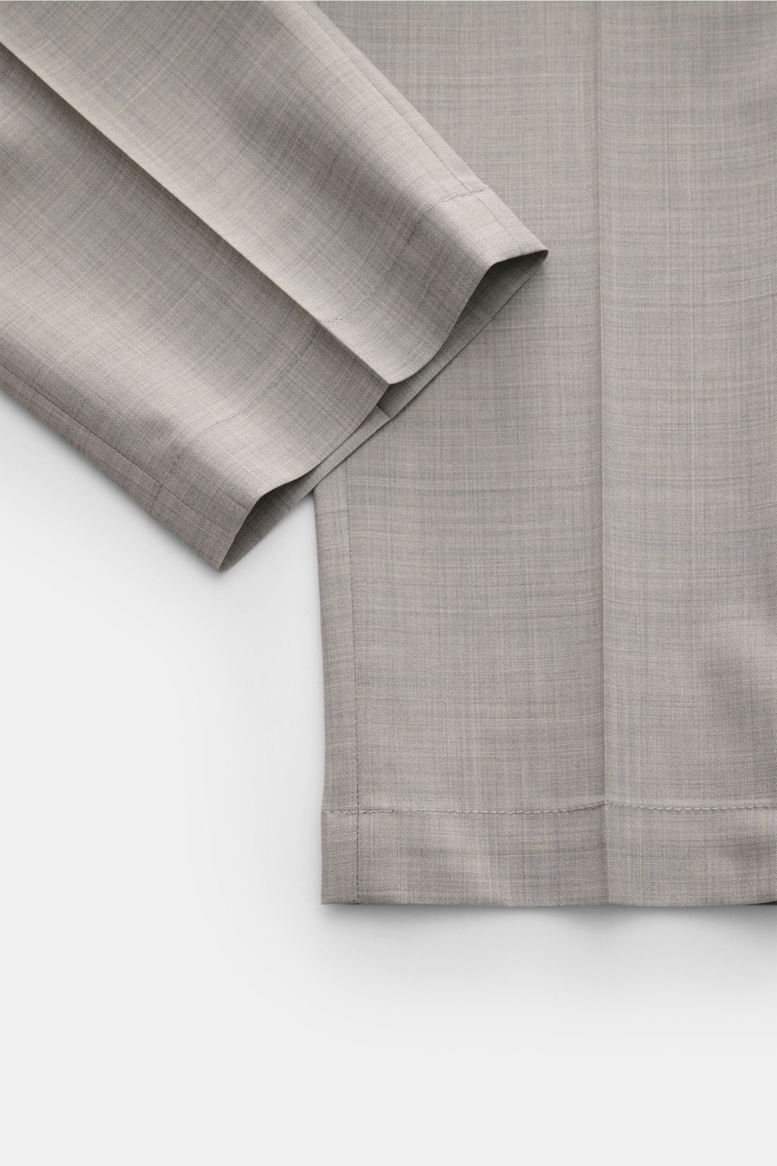 Close-up view of the hem and lower leg of Briglia 1949 Wool jogger pants 'Wimbledon' light grey mottled, showing lightweight wool blend fabric with a soft feel and tapered ankle length. Italian style and maximum comfort meet in the lightweight jogger pant