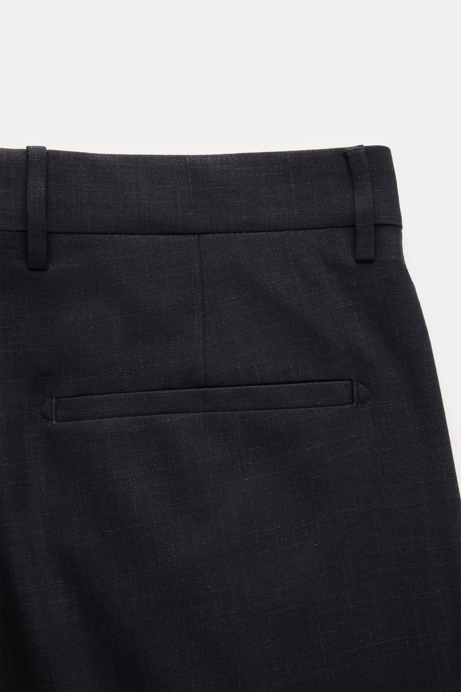 Close-up rear view of Berwich Hose 'Chiaia' dark navy meliert showing fixed hem cuff, welt back pocket, belt loops, made from wool, silk, and linen blend.
