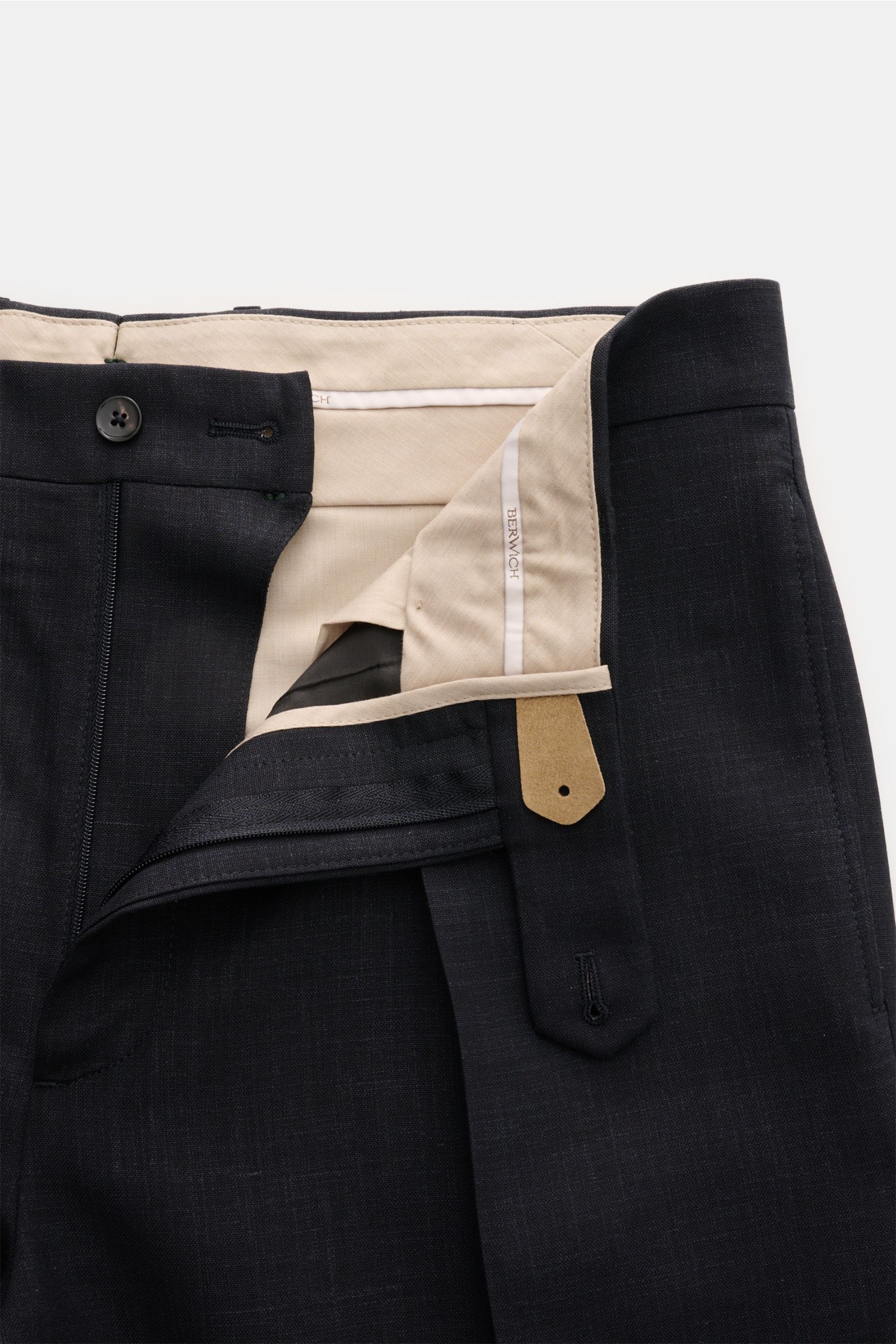 Close-up front view of Berwich Hose 'Chiaia' dark navy meliert with open waistband showing button, zipper, and beige inner lining, made from a wool, silk, and linen blend for a cooling effect, featuring tapered fit, regular thigh width, ankle length, simp