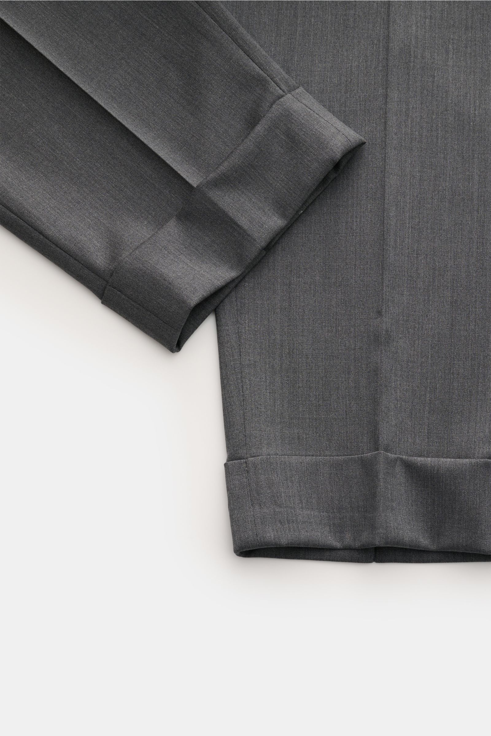 Close-up of Berwich Wool trousers 'Chiaia' grey mottled, showing tapered leg and fixed hem turn-up, photographed from above. 

Description: The wool trousers 'Chiaia' by BERWICH give expression to traditional Italian tailoring with a modern tapered fit