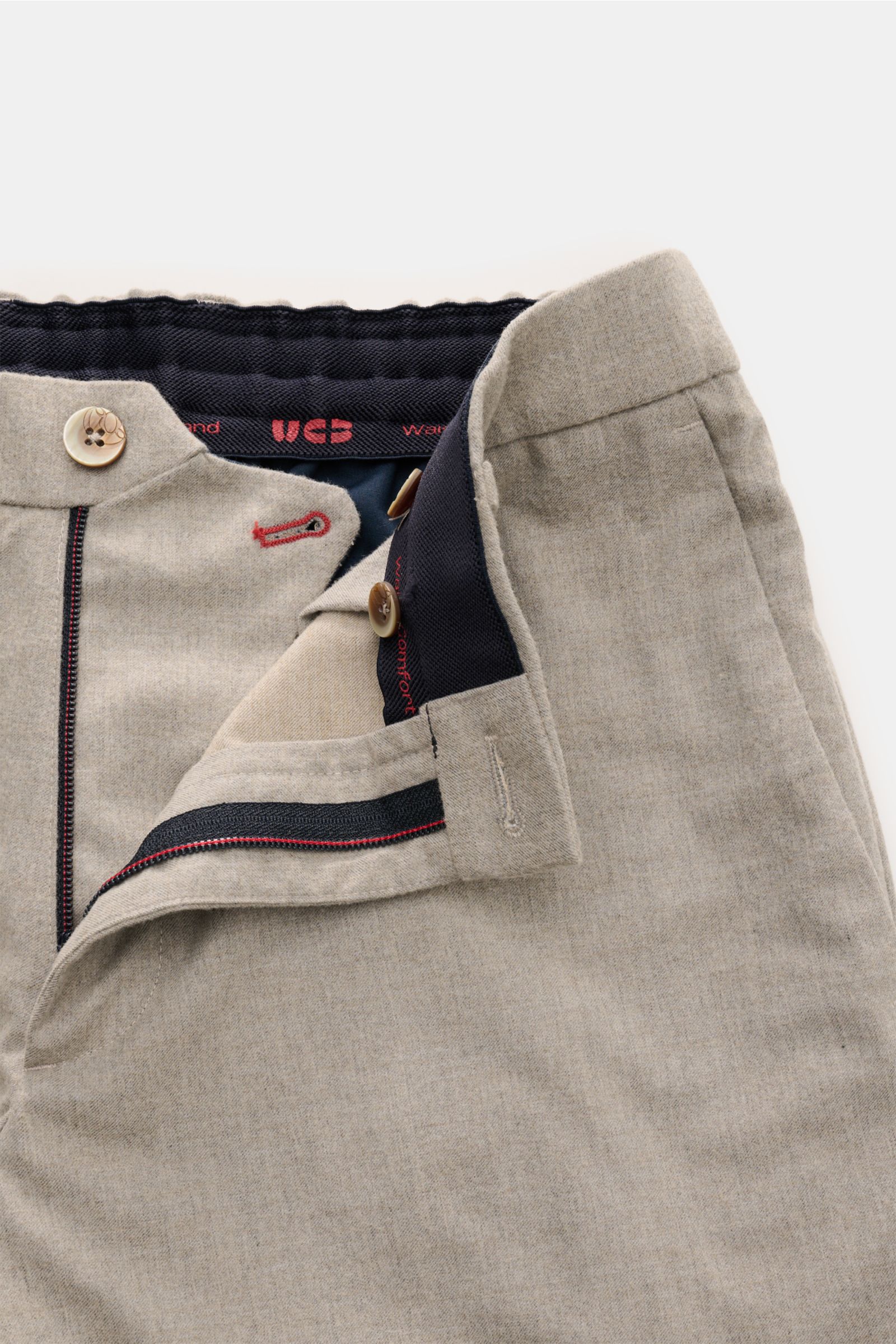 Close-up front view of GTA Trousers 'Davide' beige mottled with partially elasticated waistband, button, and zip closure.

Description: Elegance meets comfort: These trousers with a partially elasticated waistband by GTA have a comfortable fit and a ti