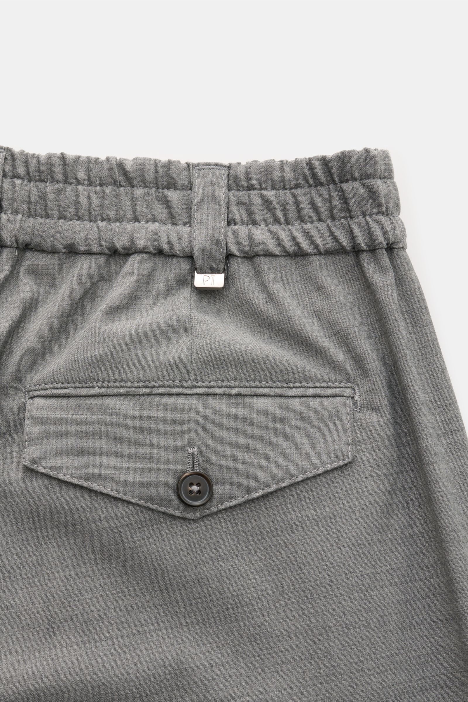 Close-up rear view of PT Torino Hose 'The Rebel' grau meliert showing elastic waistband, buttoned back pocket, and wool-microfiber fabric.

Description: 
'The Rebel' vom Hosen-Experten PT TORINO ist Ihnen garantiert ein treuer Begleiter im Frühling sow