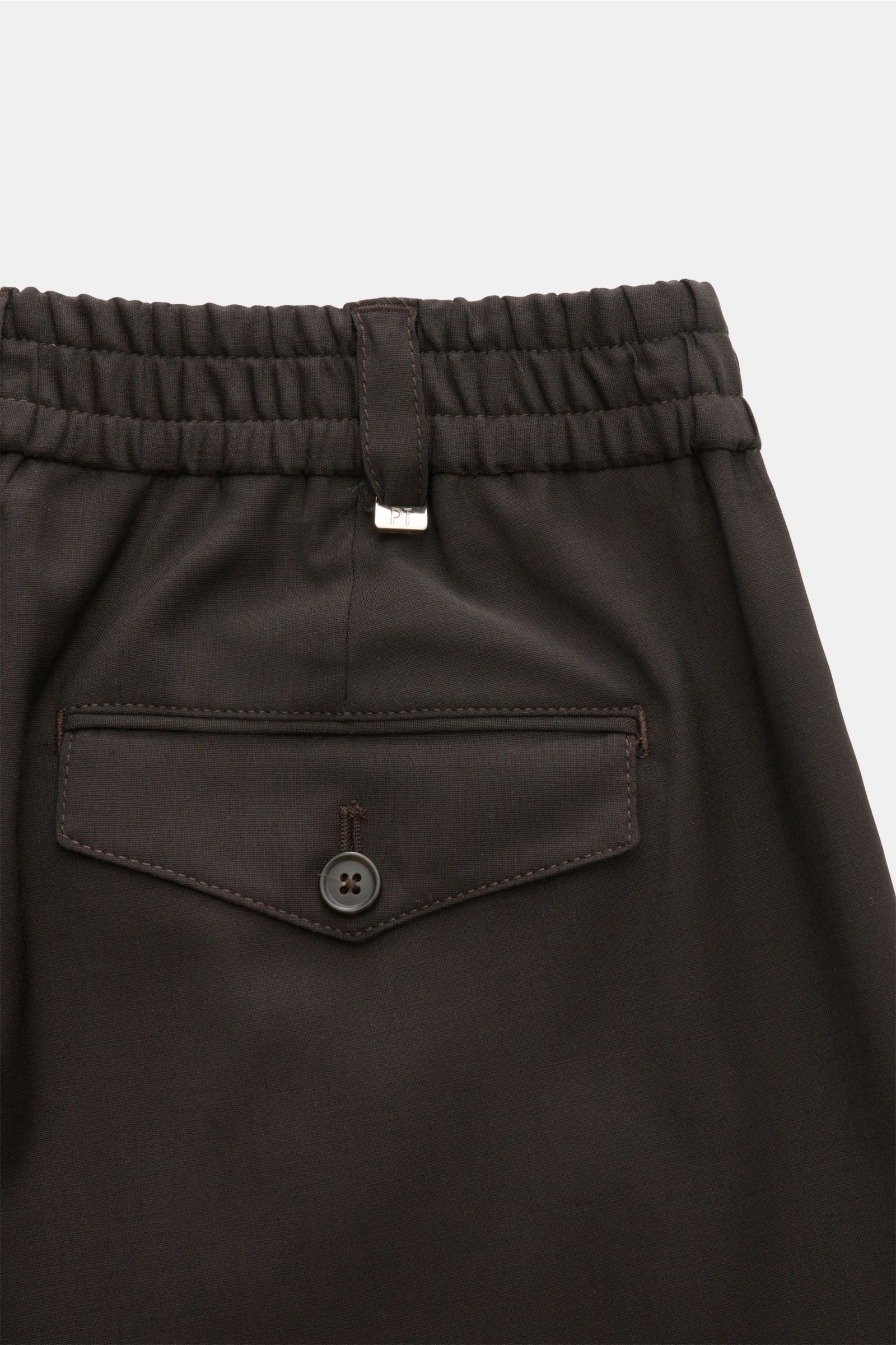 Close-up back view of PT Torino Trousers 'The Rebel' dark brown showing elastic waistband, belt loop with metal detail, and button flap pocket, made from a soft wool and microfibre blend, featuring Rebel Fit, regular thigh width, ankle length, button fly,