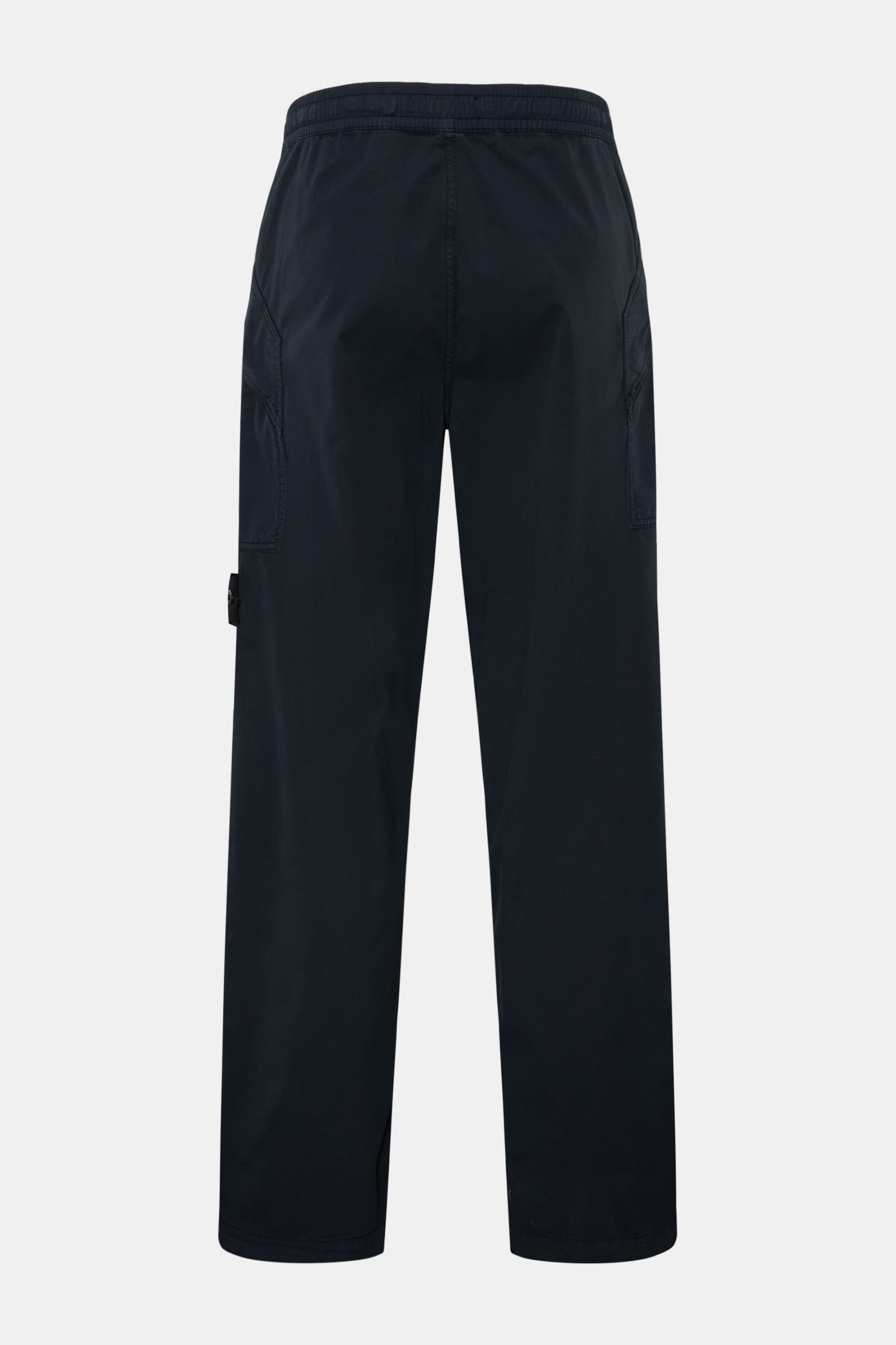 Stone Island Joggpants navy shown from the back, made of lightly elastic cotton with zipper pockets, elastic waistband, and compass badge.