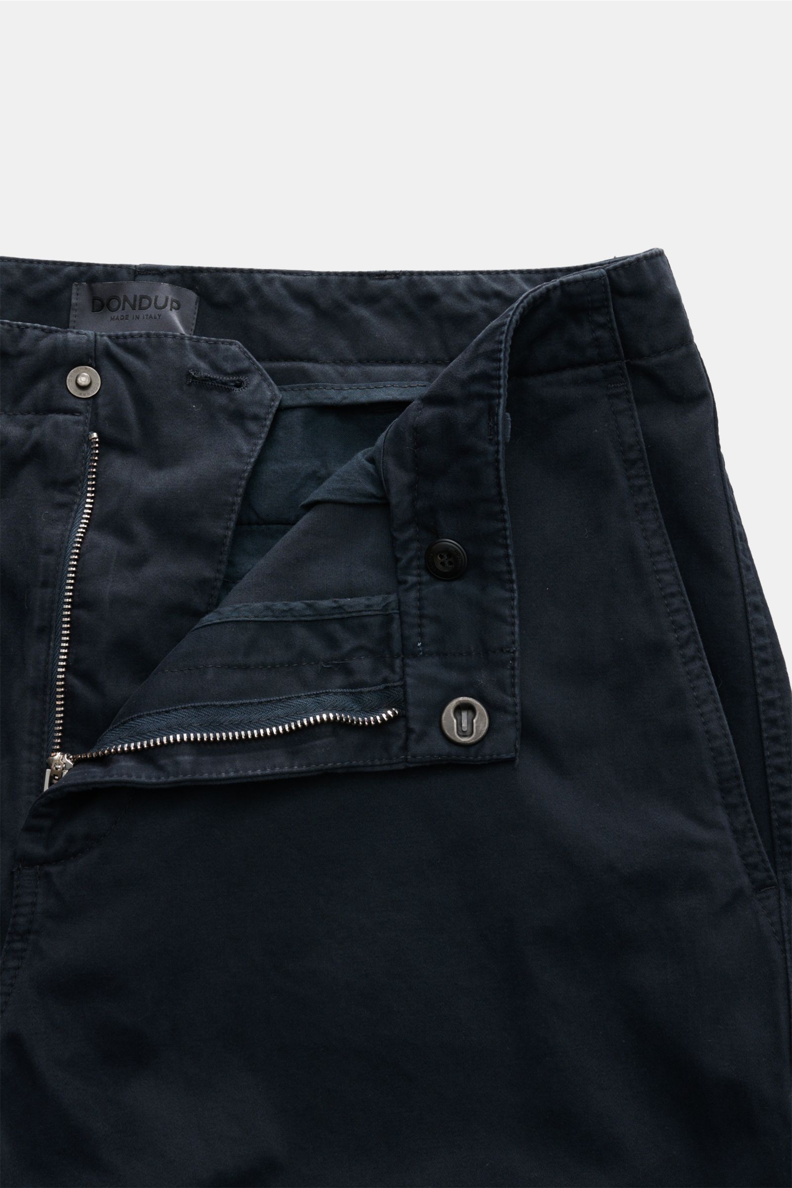Close-up front view of Dondup Cotton trousers dark navy with open zipper, waist button, and visible stitching on pure cotton fabric. 

Description: A timeless companion for any occasion: These cotton trousers by DONDUP combine comfort with stylish eleg