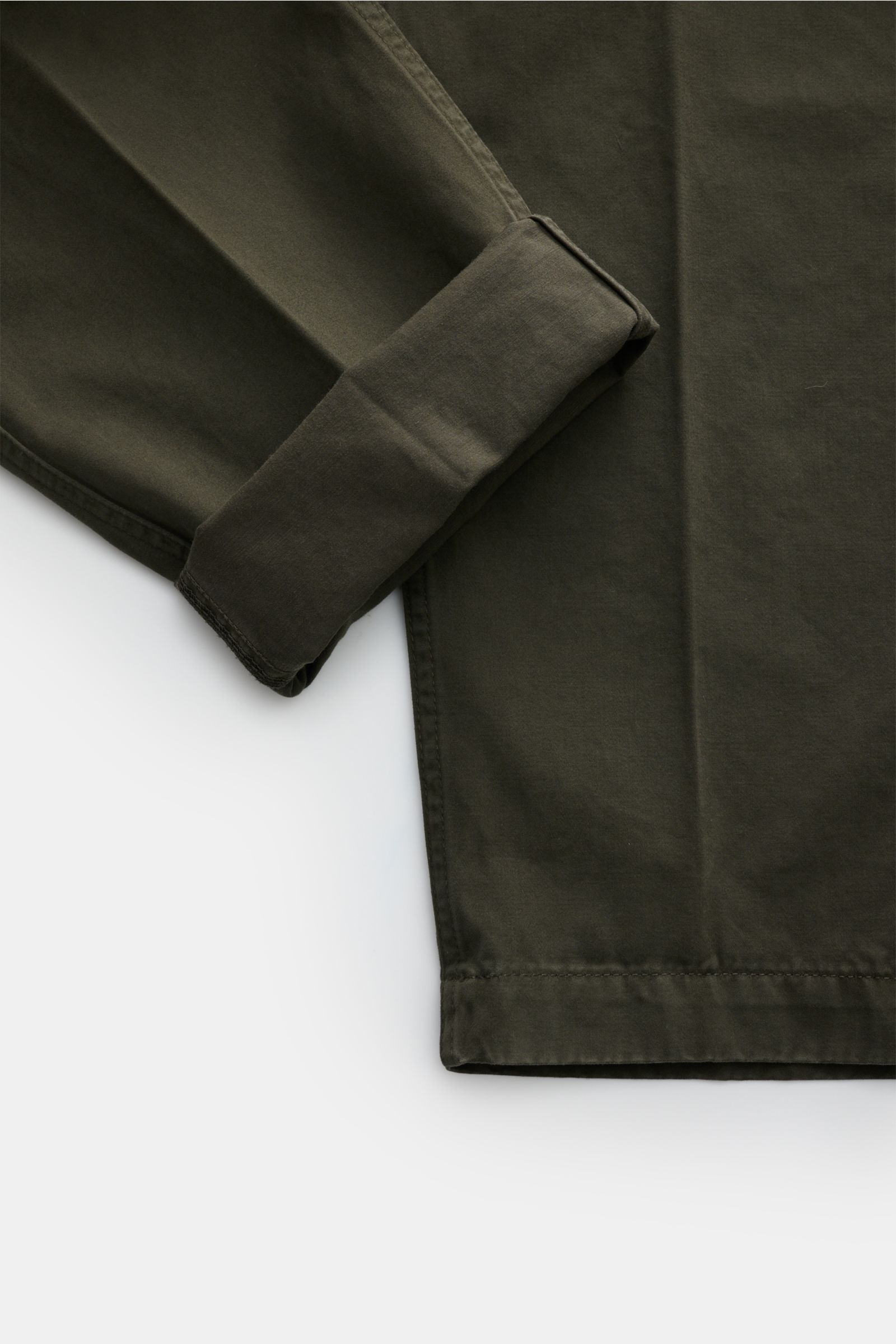 Close-up front view of the lower leg and cuff of Dondup Cotton trousers dark green, showcasing pure cotton fabric, soft feel, tapered ankle-length fit with a slightly tapered cut. 

Description: A timeless companion for any occasion: These cotton trous