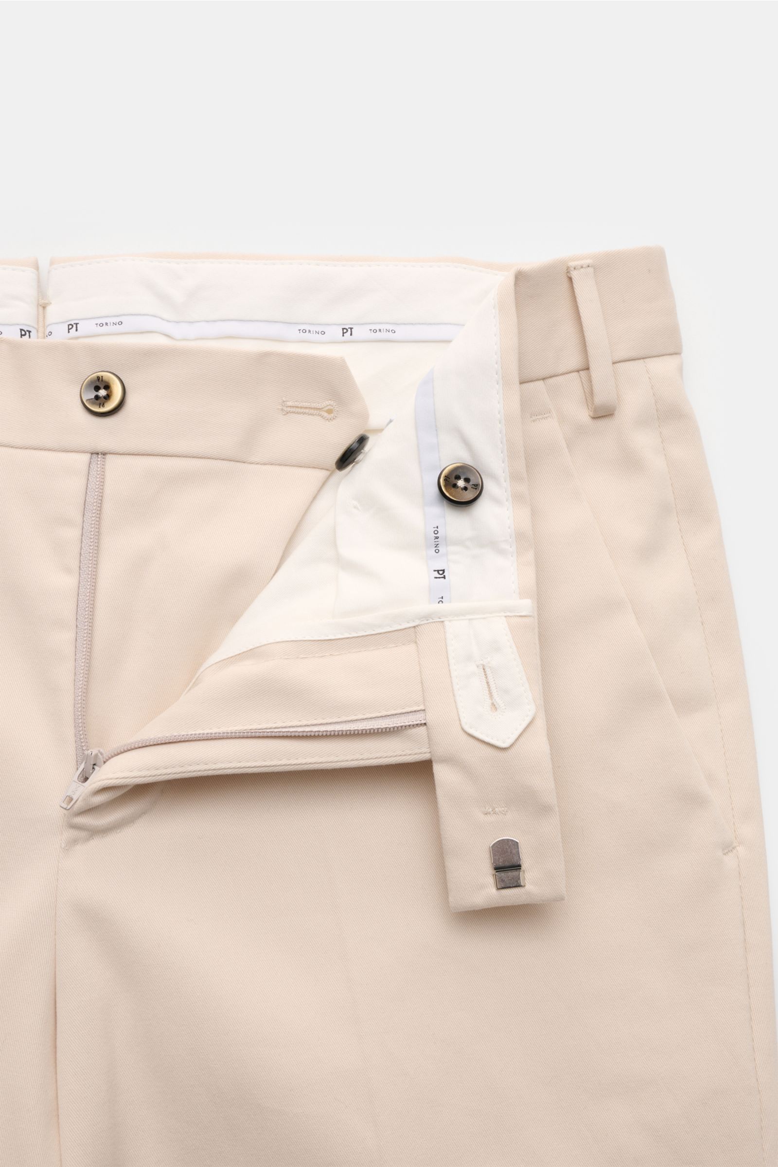 Close-up front view of PT Torino Cotton trousers 'Master Fit' sand, showing zipper, button, hook fastener, and belt loops.

A stylish all-rounder: The trousers 'Master Fit' by PT TORINO made of brushed cotton with slight stretch content have a soft fee