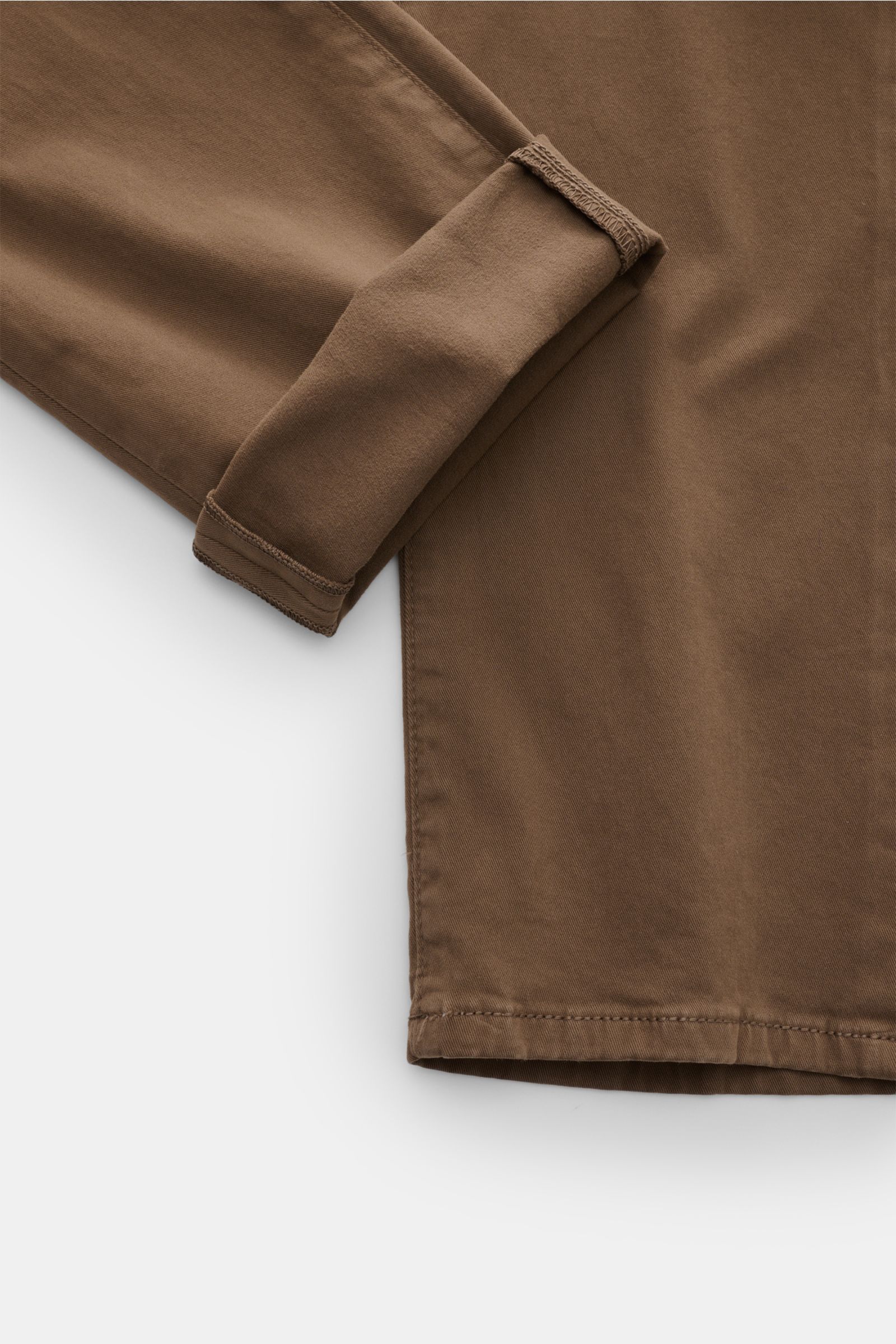 HandPicked Chinos 'Parma' brown shown from a close-up top-down perspective, highlighting cotton twill fabric with slightly elasticated, soft feel, slim fit, very tapered cut, button fly, French pockets, coin pocket with initial, back pockets with stitchin