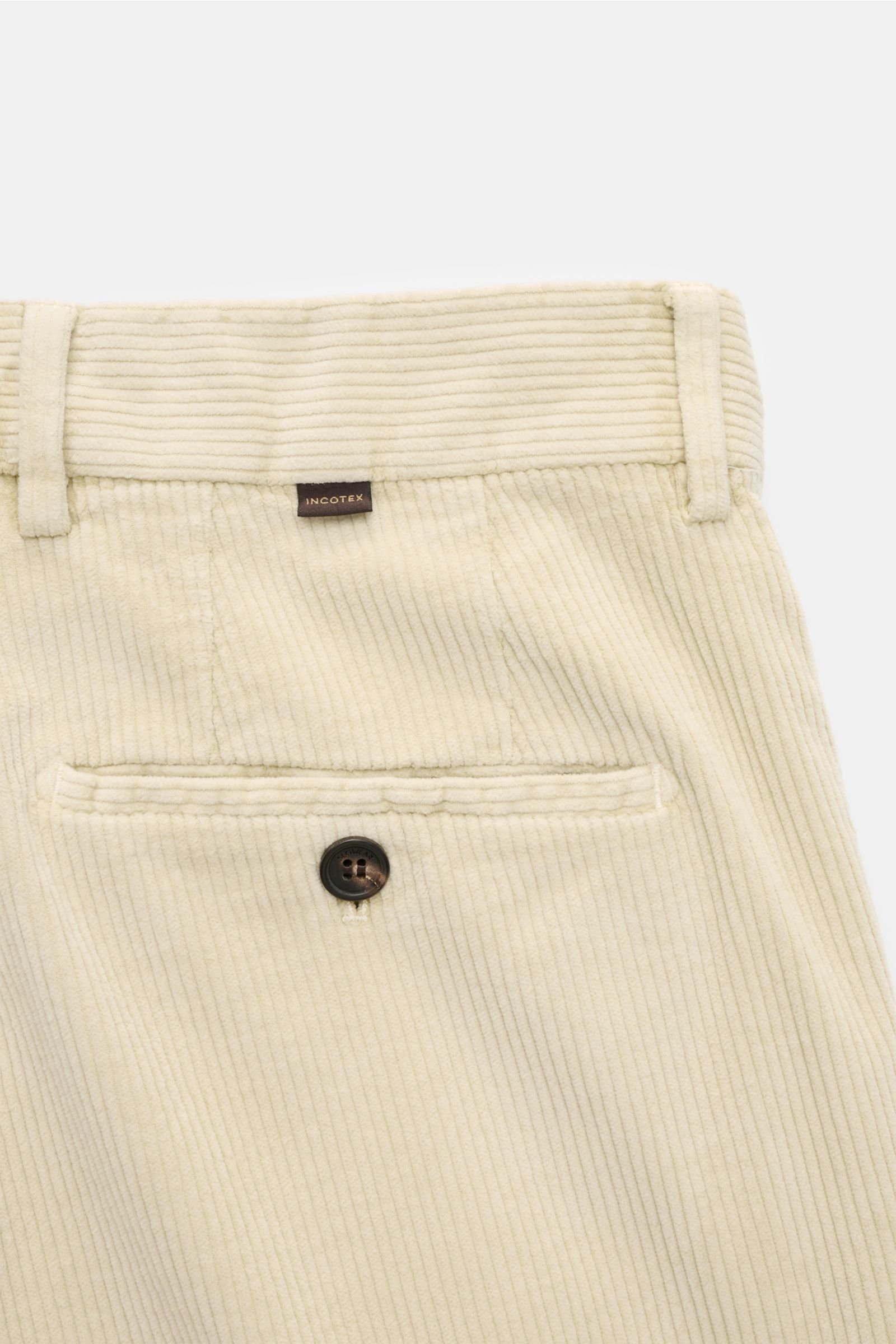 Close-up rear view of Incotex Cordhose sand featuring corduroy cotton and microfiber fabric, soft touch, garment dyed, tapered fit with regular thigh width, ankle length, narrow tapering, zipper and button waistband, French pockets, small watch pocket, bu
