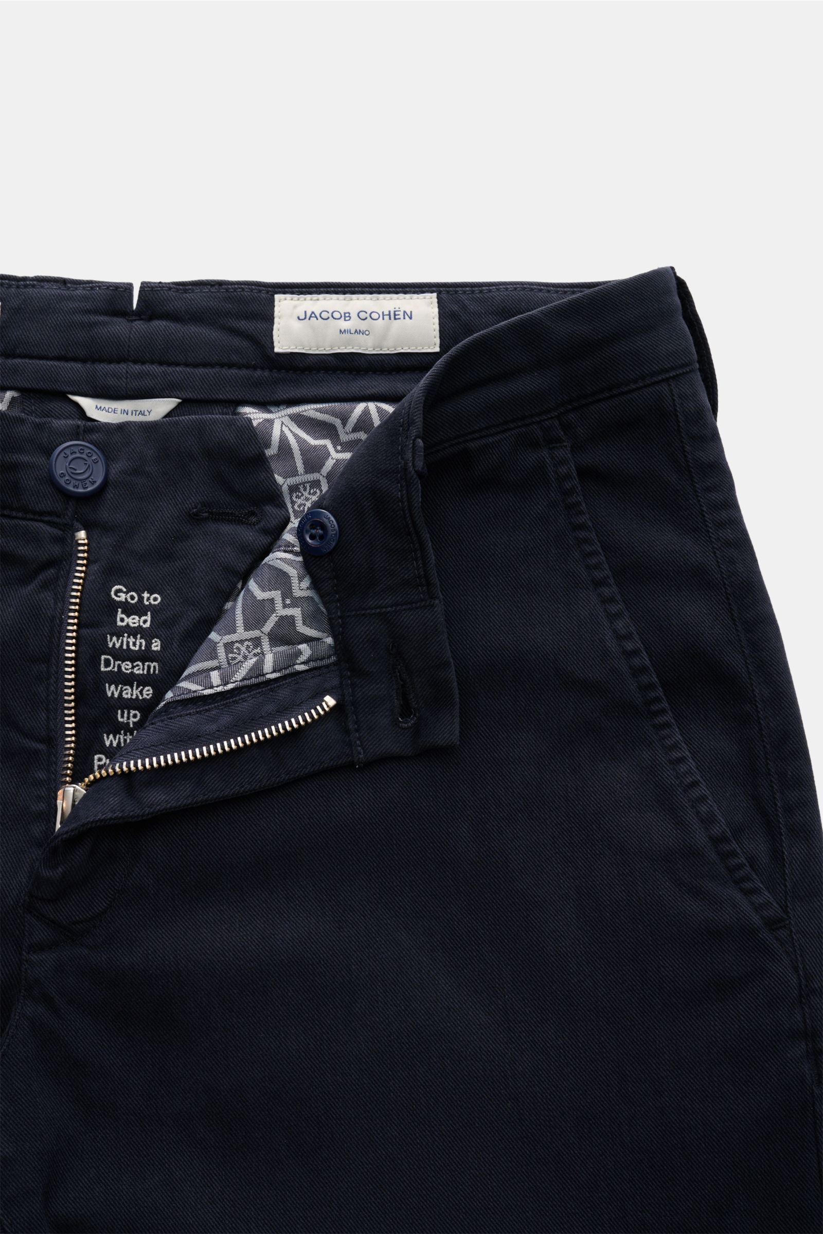 Close-up front view of Jacob Cohen Chino 'Bobby' navy cotton-twill slim fit pants with zipper, button, and patterned inner lining, showing precise Italian craftsmanship. Twill cotton and lyocell blend, elastic quality, soft touch, garment dyed, low waist,