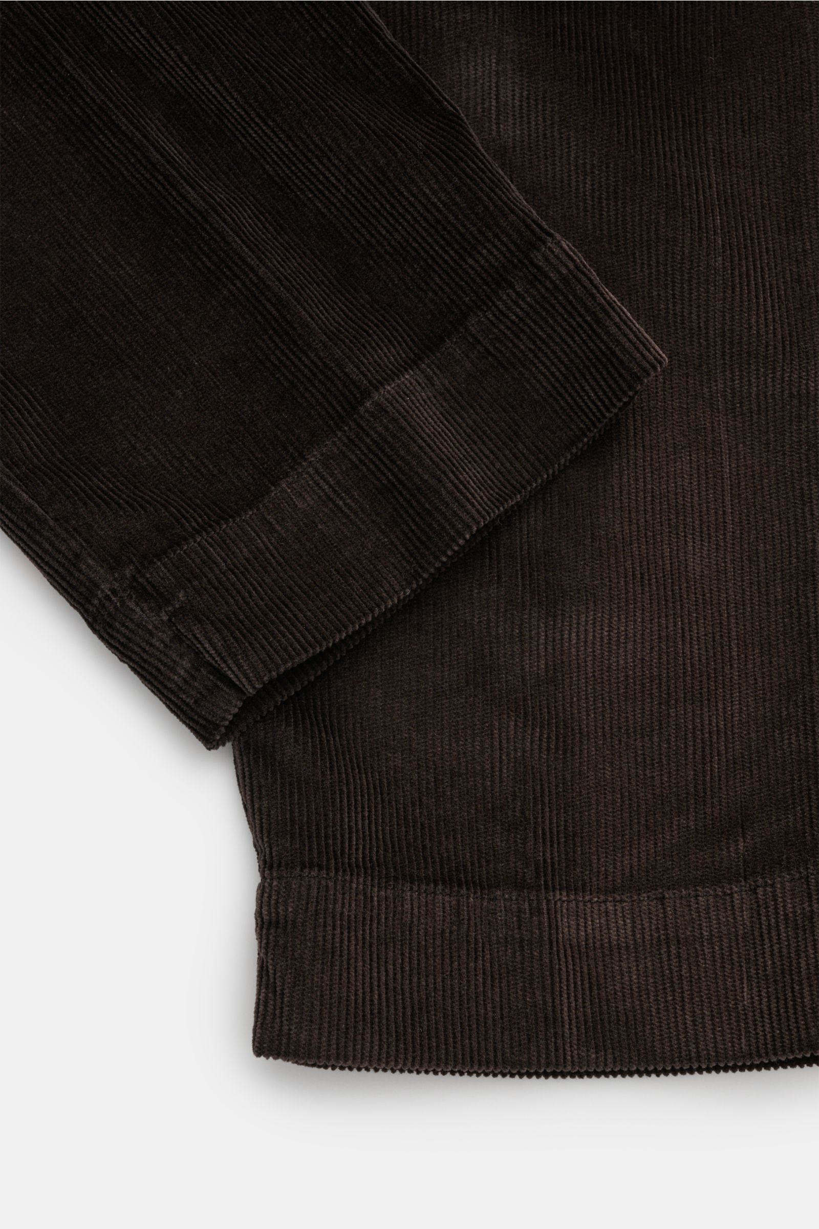 Close-up front view of 04651/ A trip in a bag Cordhose dunkelbraun showing dark brown garment dyed cotton-modal corduroy fabric with stretch, part-elastic waistband, and fine ribbed texture.

Description to include: Welcome to the Autumn Winter Collect