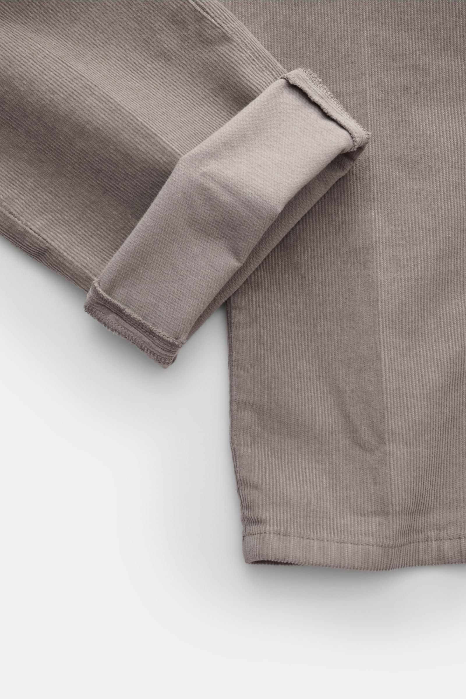 Dondup Cordhose 'Gaubert' grau aus feinem Baumwollcord mit leichtem Stretch, schmal zulaufend, Detailansicht Saum und Innenfutter.