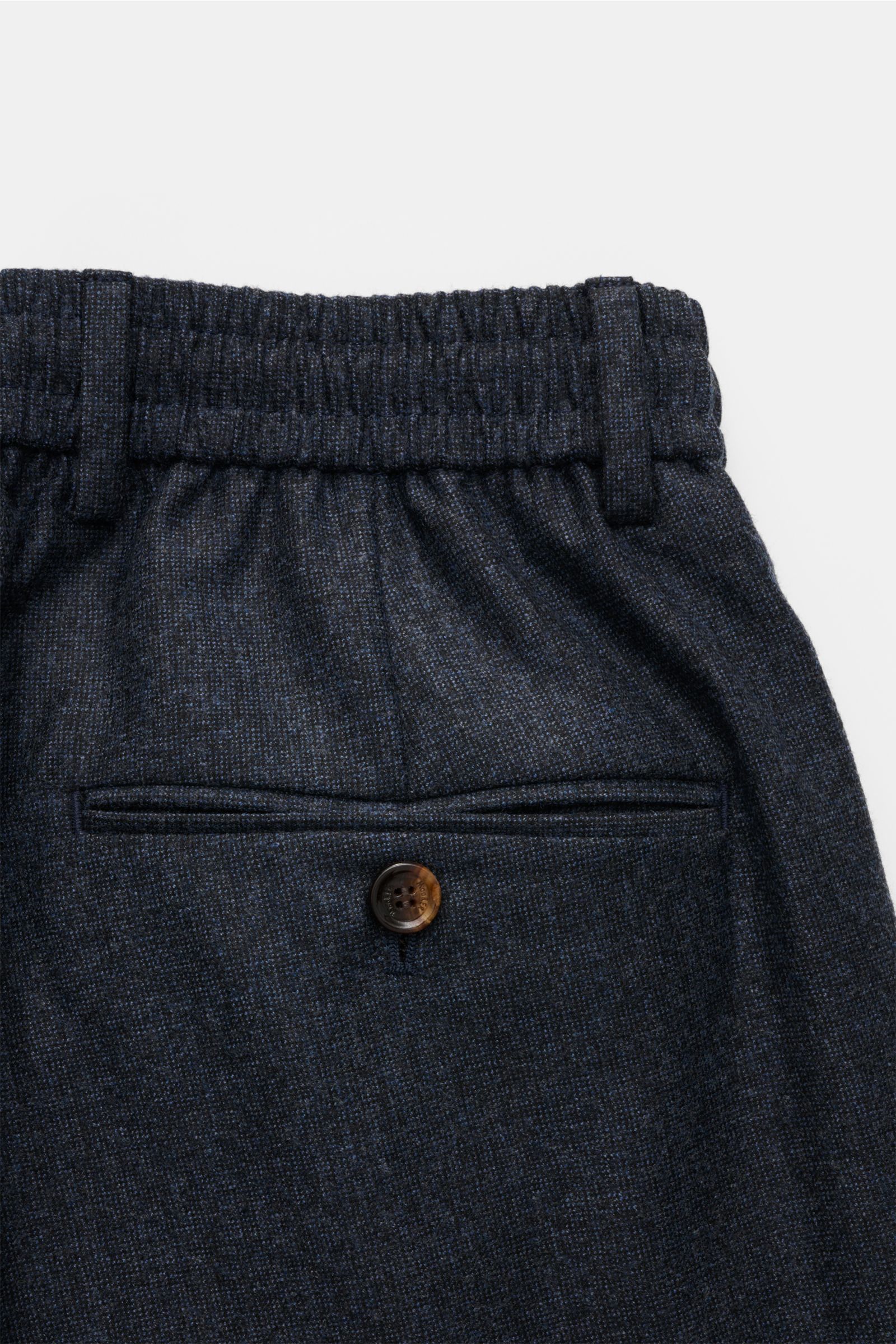 Close-up rear view of Moorer Woll-Jogpants 'Anton' dunkelblau meliert showing elastic waistband, buttoned welt pocket, and soft wool fabric.