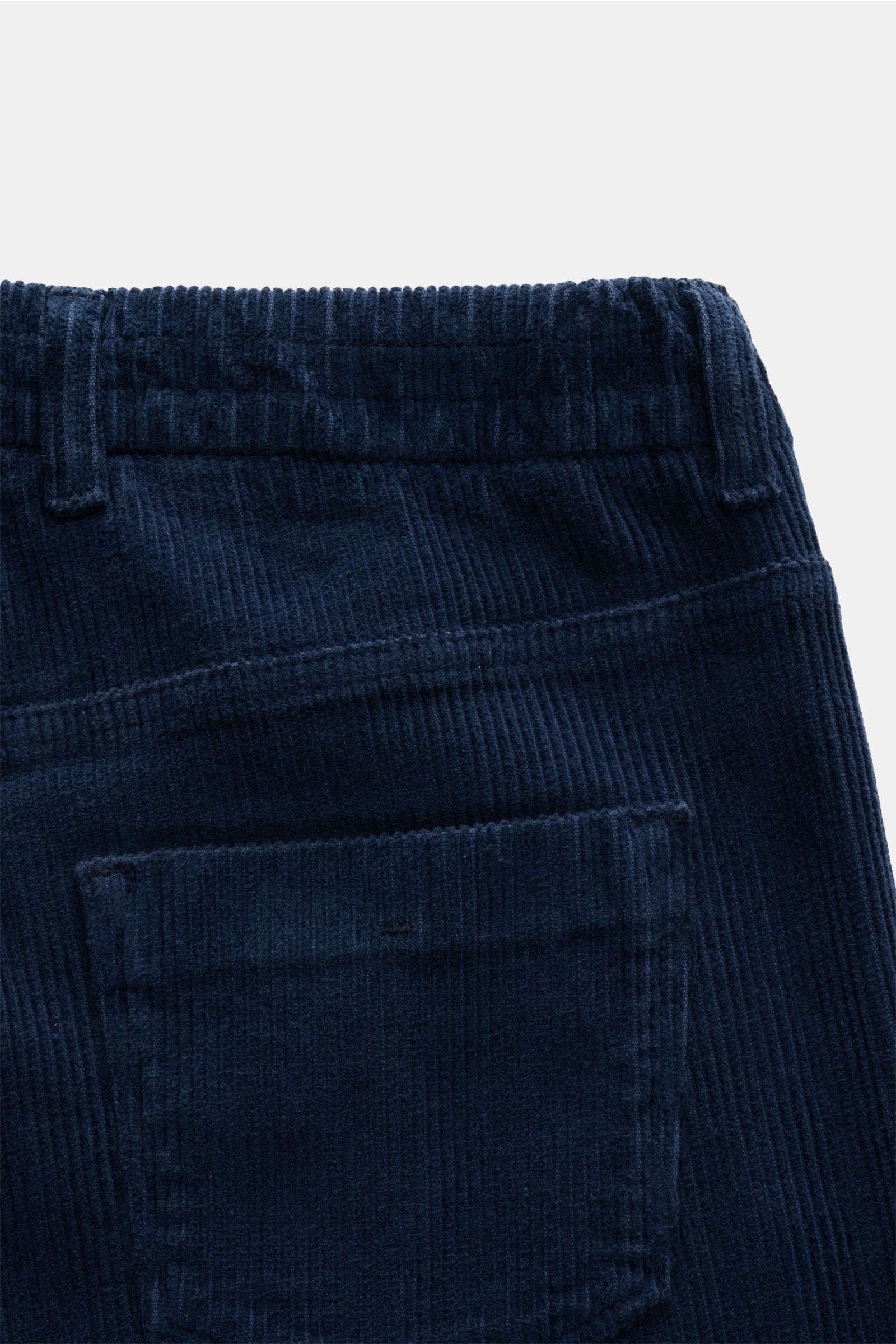 Close-up rear view of Ace Denim Corduroy jogger pants navy showing soft pure cotton fabric, elasticated waistband with drawstring, slim fit, tapered cut, zip and waist button, single pleat, and French pockets.