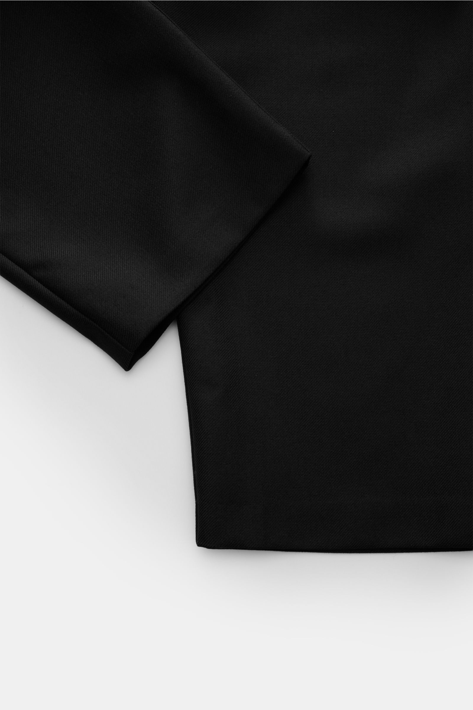 A.P.C. Trousers 'Renato' black shown from a close-up side angle, highlighting the ankle-length tapered cut and high-quality wool-microfibre blend fabric. Stylish classic: Trousers 'Renato' by A.P.C. have an elegant design that makes them an incomparable e