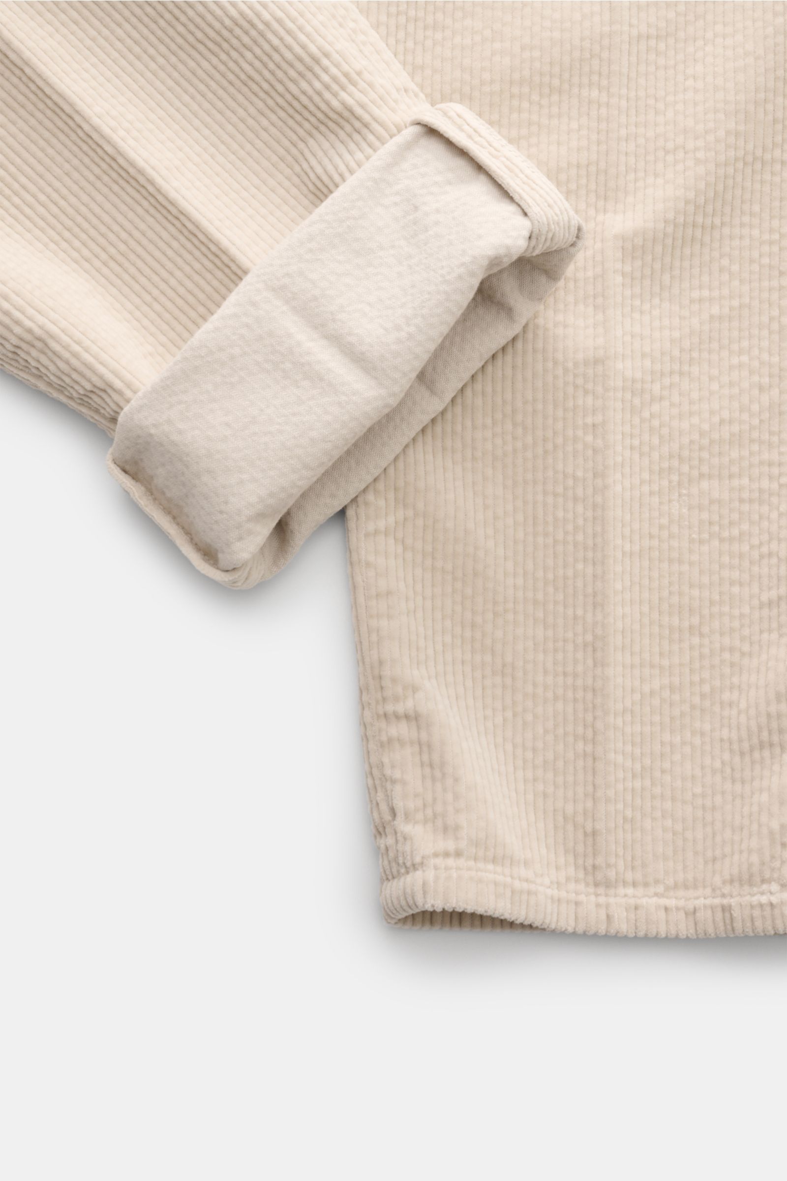 Close-up top-down view of Brunello Cucinelli Cordhose creme showing soft cream-colored corduroy fabric and cuff detail.

Additional description for context:  
Eleganz mit jedem Schritt: Die Cordhose von BRUNELLO CUCINELLI verspricht höchsten Tragekomfo