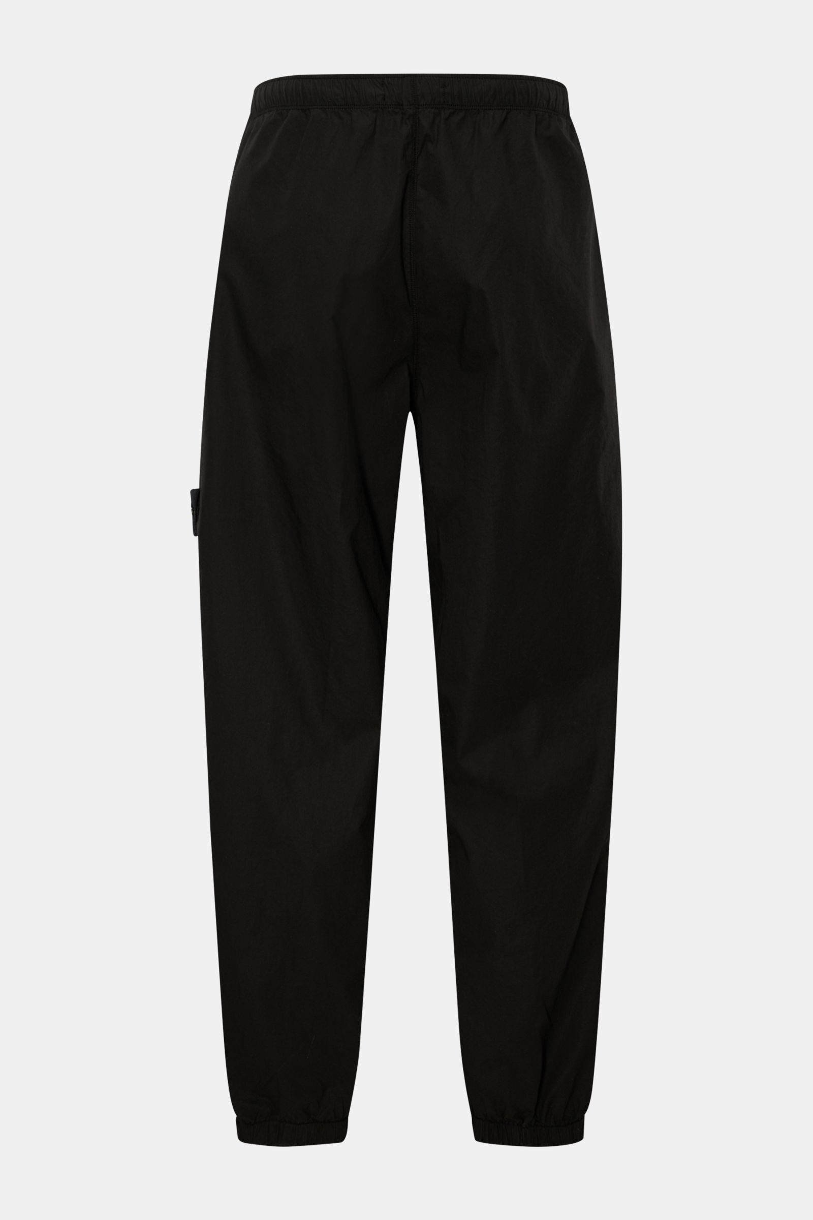 Stone Island Jogpants schwarz von hinten, knöchellang mit elastischem Bund, Rippstrick-Einsatz, Zipper-Taschen, Tapered Fit, Baumwolle