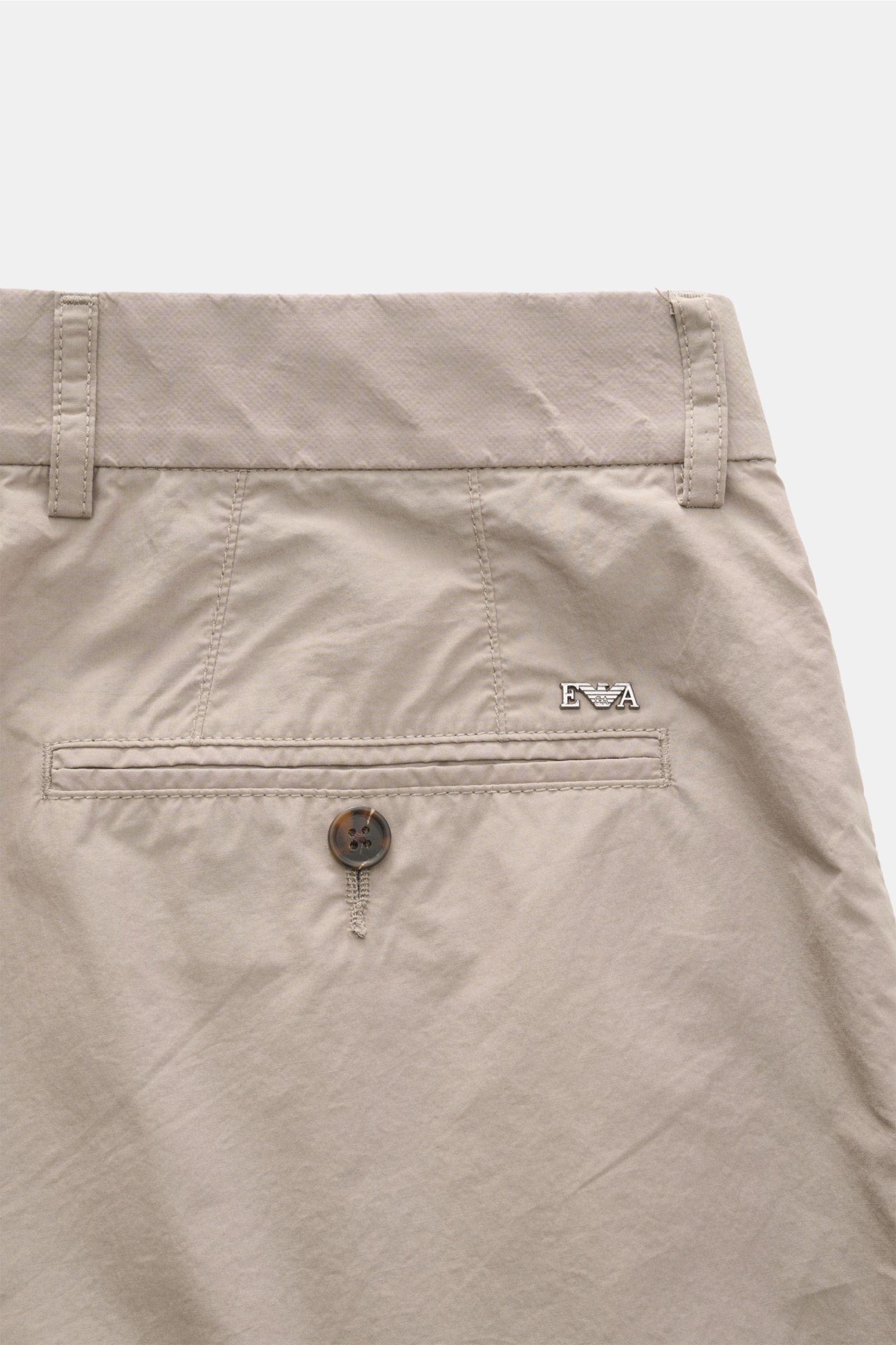 Close-up rear view of Emporio Armani Cotton trousers taupe showing jetted back pocket with button, belt loops, and logo detail. Summer essential: These light cotton trousers by EMPORIO ARMANI are luxuriously lightweight and create stylish looks even in hi