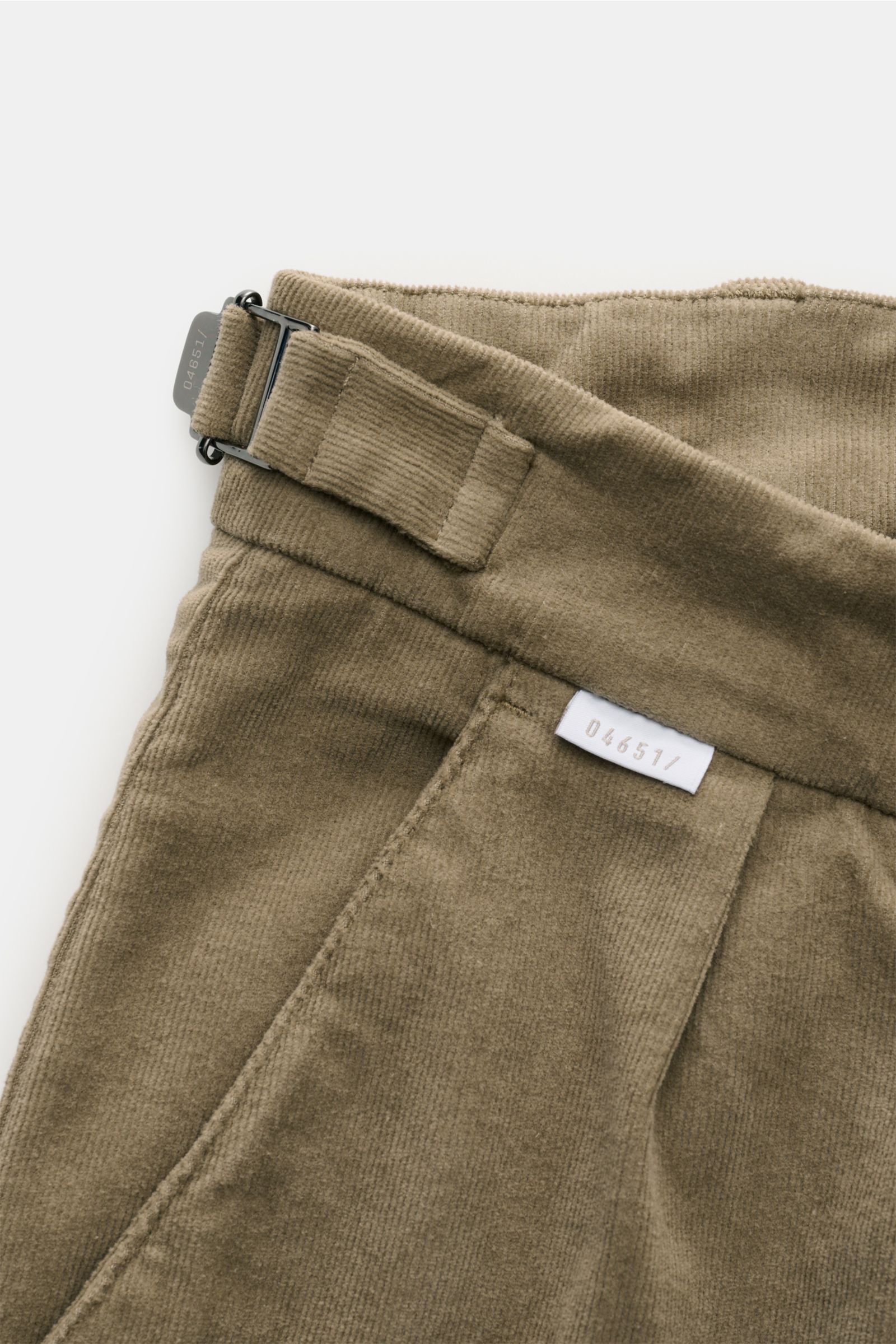 Close-up of 04651/ A trip in a bag Corduroy trousers taupe, showing double pleat, side adjuster, soft cotton stretch fabric from top front angle.
