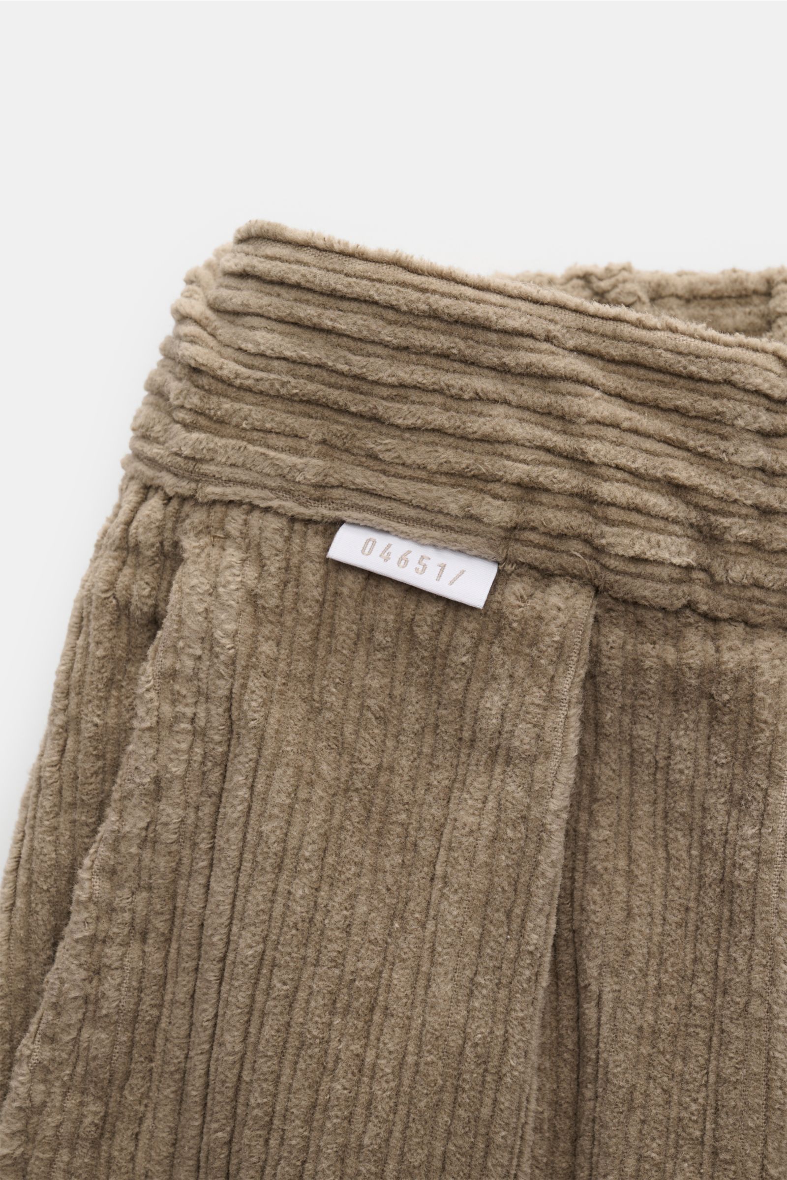 Close-up front view of 04651/ A trip in a bag Corduroy cargo pants taupe showing wide wale cotton corduroy, soft feel, slight stretch, tapered fit, regular thigh width, ankle length, zip and waist button, partially elasticated waistband with drawstring, F