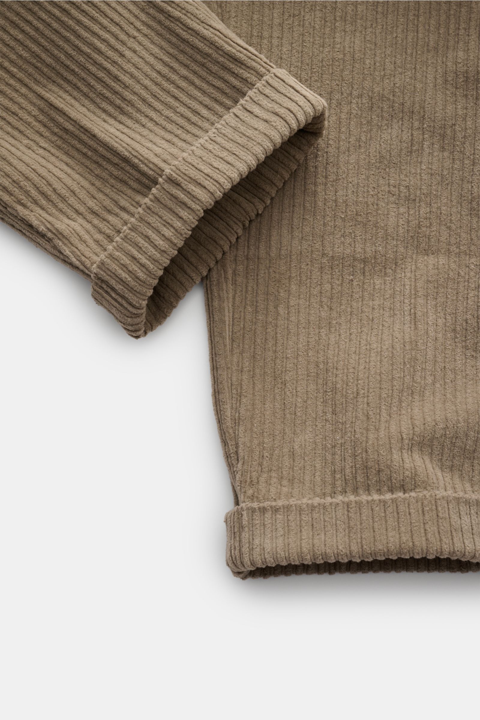 Close-up image of the fixed hem turn-up and tapered ankle of the 04651/ A trip in a bag Corduroy cargo pants taupe, showing wide wale cotton corduroy with slight stretch, soft feel, and tapered fit.