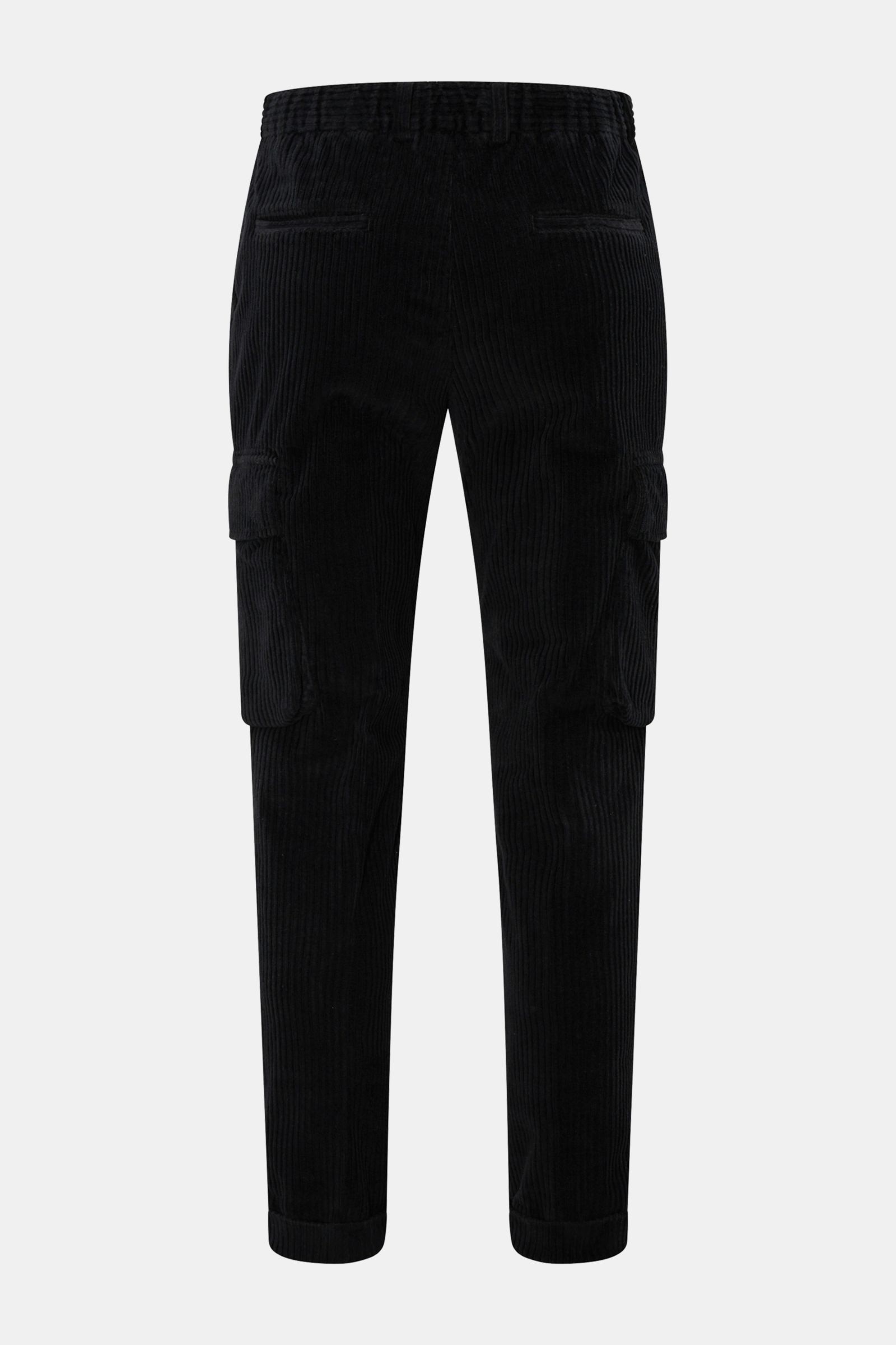 Rear view of 04651/ A trip in a bag Corduroy cargo pants black in wide wale cotton corduroy with slight stretch, soft feel, tapered fit, regular thigh width, ankle length, slightly tapered cut, zip and waist button, partially elasticated waistband with dr
