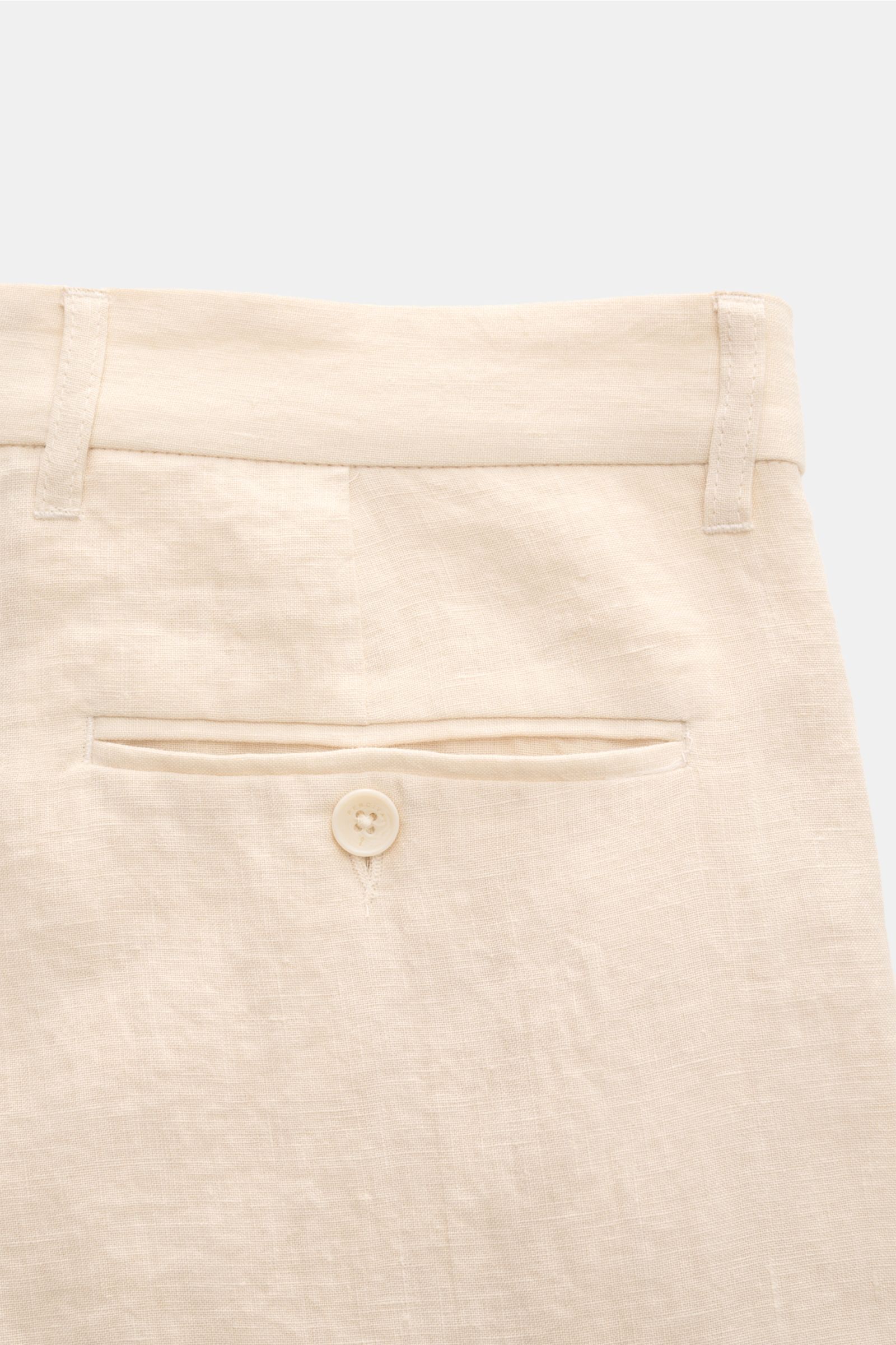 Close-up rear view of Percival Trousers 'Tailored Linen' cream mottled, showing jetted back pocket with button on linen-cotton fabric.

Stay smart this summer: The straight cut trousers 'Tailored Linen' made of linen and cotton by London label PERCIVAL