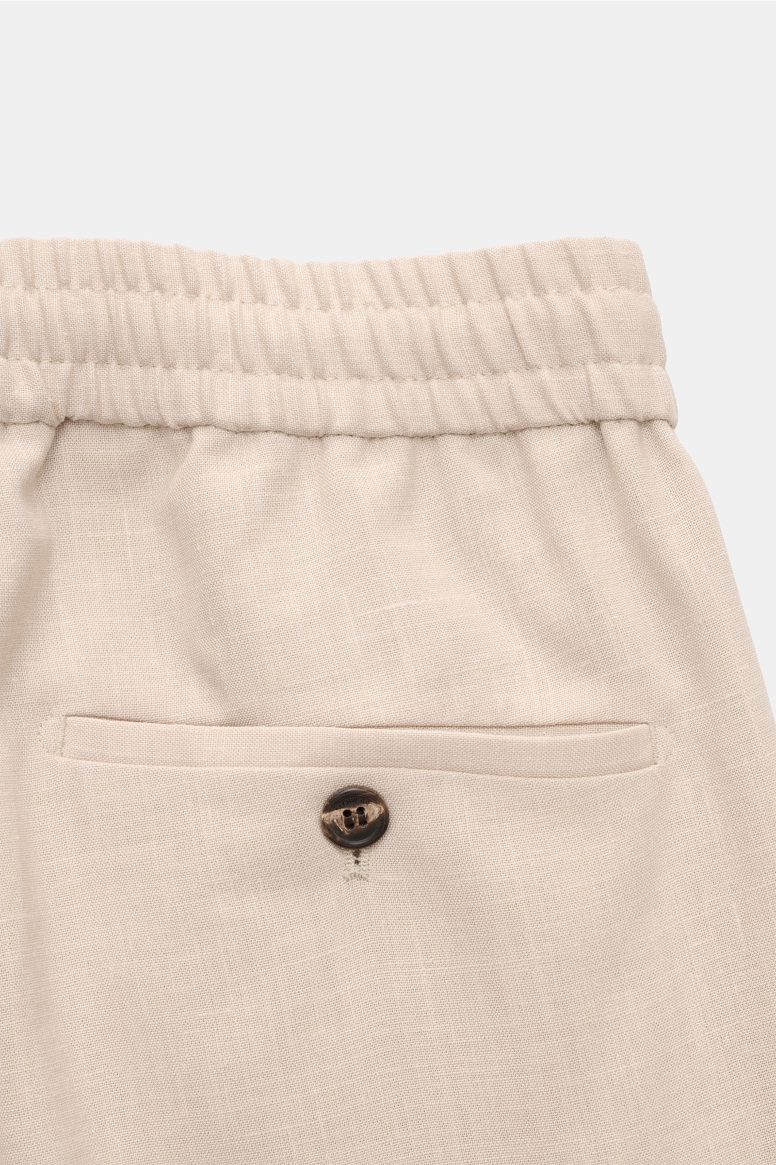 Incotex Jogger pants sand shown from a close-up rear view, highlighting elasticated waistband, buttoned back pocket, fine wool, silk, and linen blend fabric.