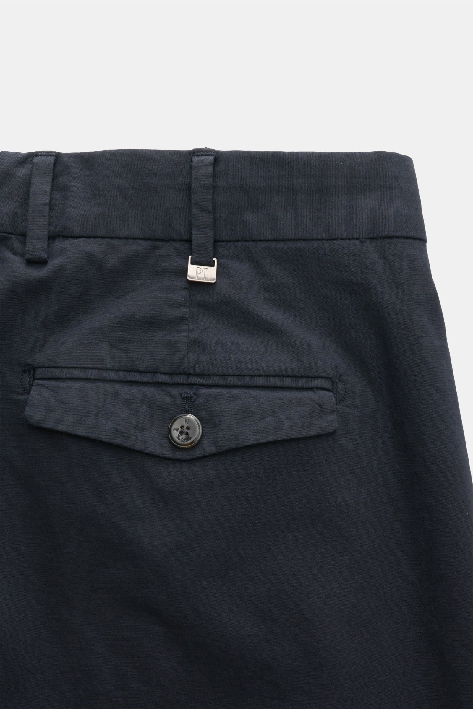 Close-up rear view of PT Torino Chinos 'Rebel Fit' dark navy, showing back pocket with flap and button, belt loops, and small metal initial. 

Description: You can’t go wrong with PT TORINO: These comfortably cut chinos made of cotton in a trendy taper