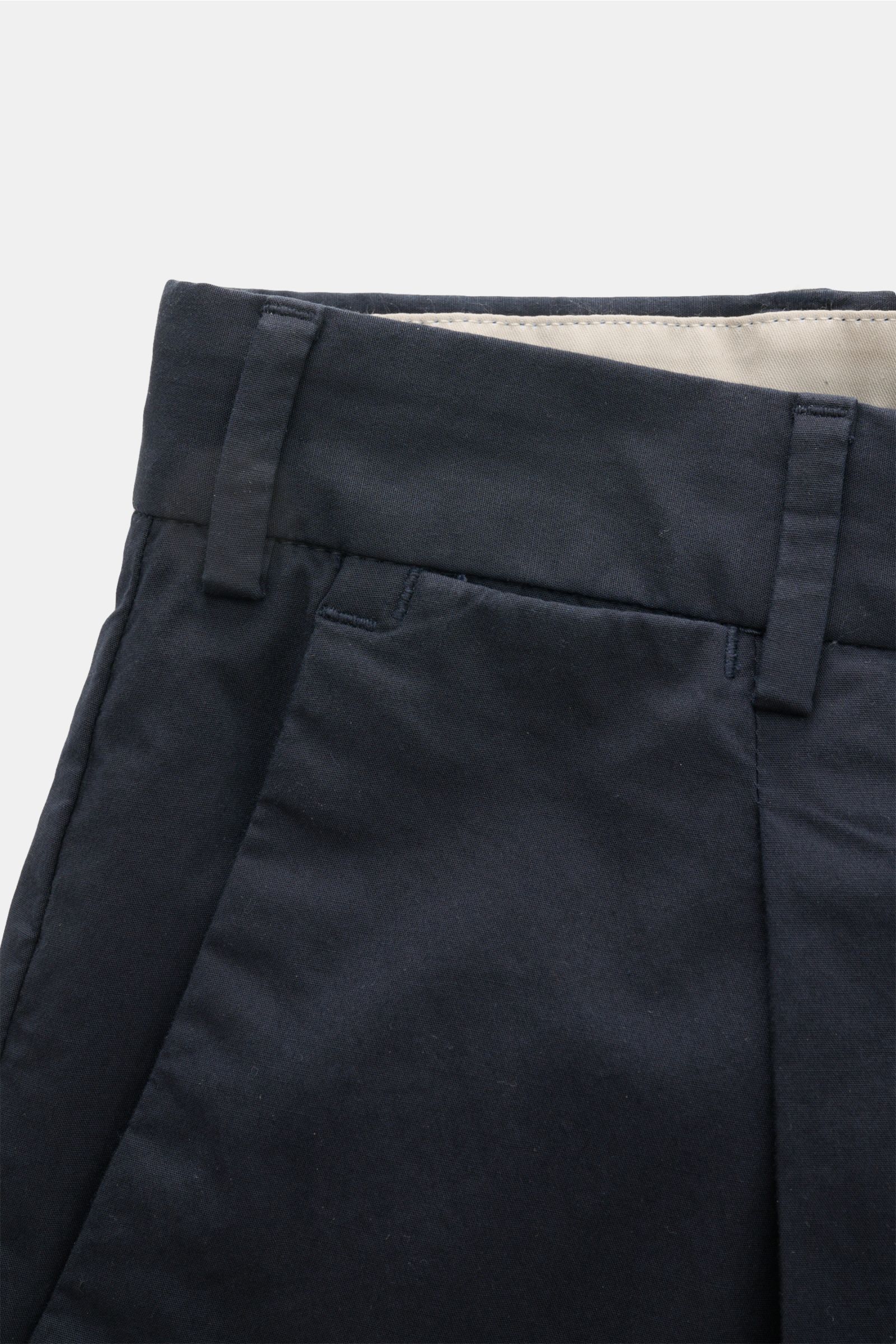 Close-up front view of PT Torino Chinos 'Rebel Fit' dark navy, showing waistband, belt loops, single pleat, and cotton fabric. You can’t go wrong with PT TORINO: These comfortably cut chinos made of cotton in a trendy tapered fit are a stylish companion f