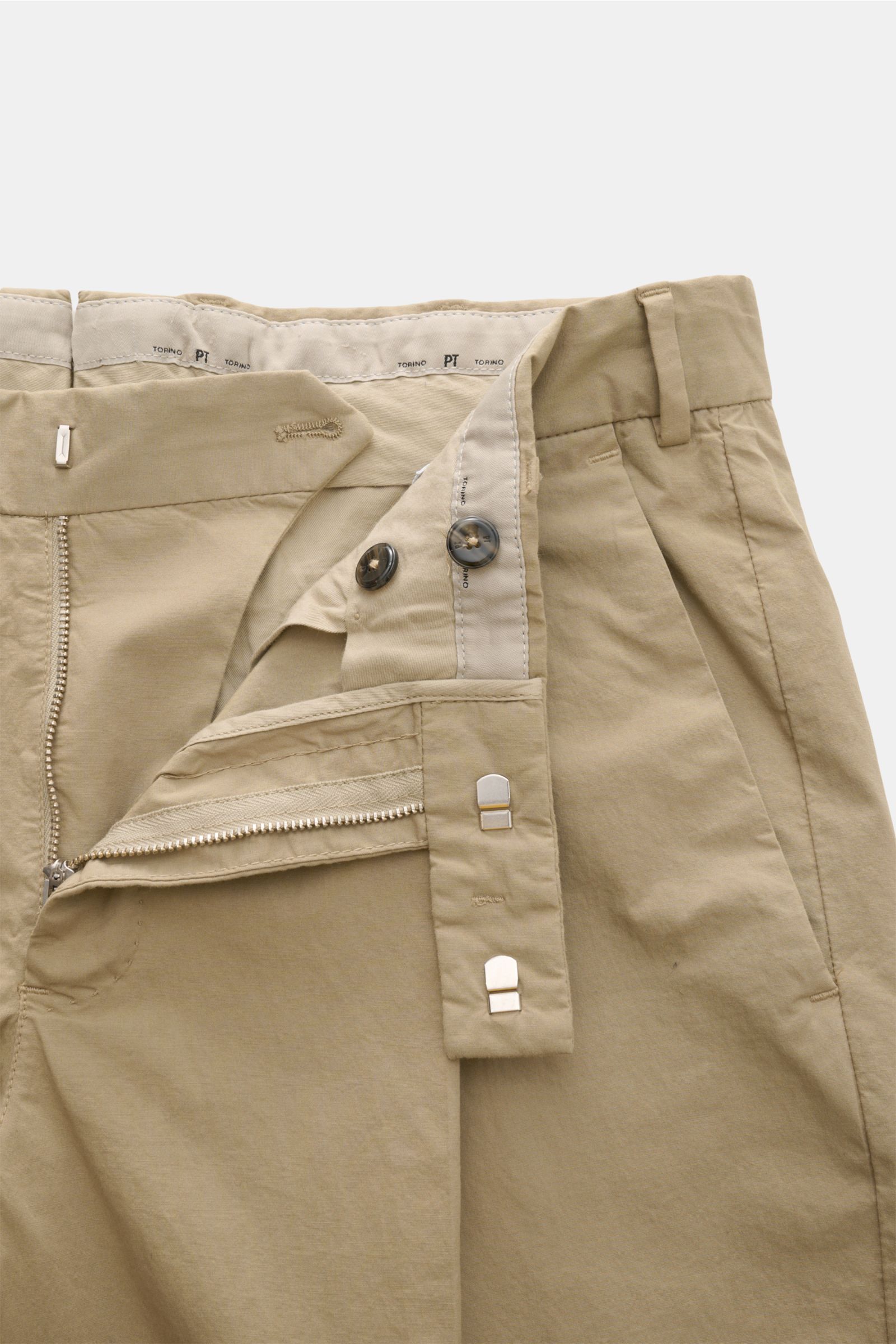Front close-up of PT Torino Chinos 'Rebel Fit' beige showing zipper, hook fastener, buttons, and tapered cotton fabric.

Description: You can’t go wrong with PT TORINO: These comfortably cut chinos made of cotton in a trendy tapered fit are a stylish comp