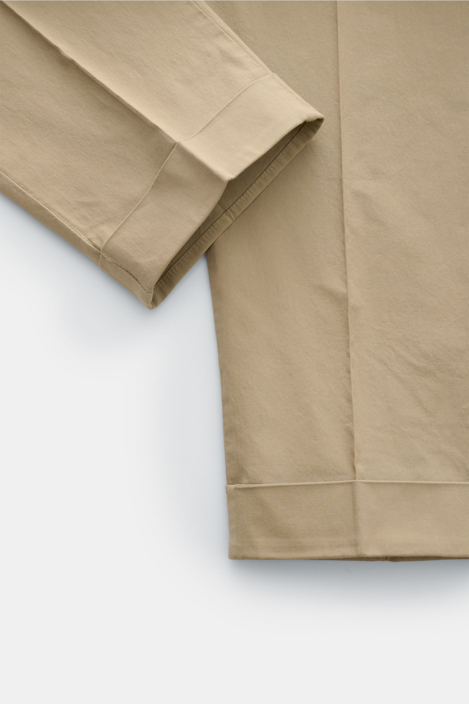 Close-up front view of PT Torino Chinos 'Rebel Fit' beige cotton chinos showing tapered fit, fixed hem turn-up, and detailed stitching.

Description: You can’t go wrong with PT TORINO: These comfortably cut chinos made of cotton in a trendy tapered fit