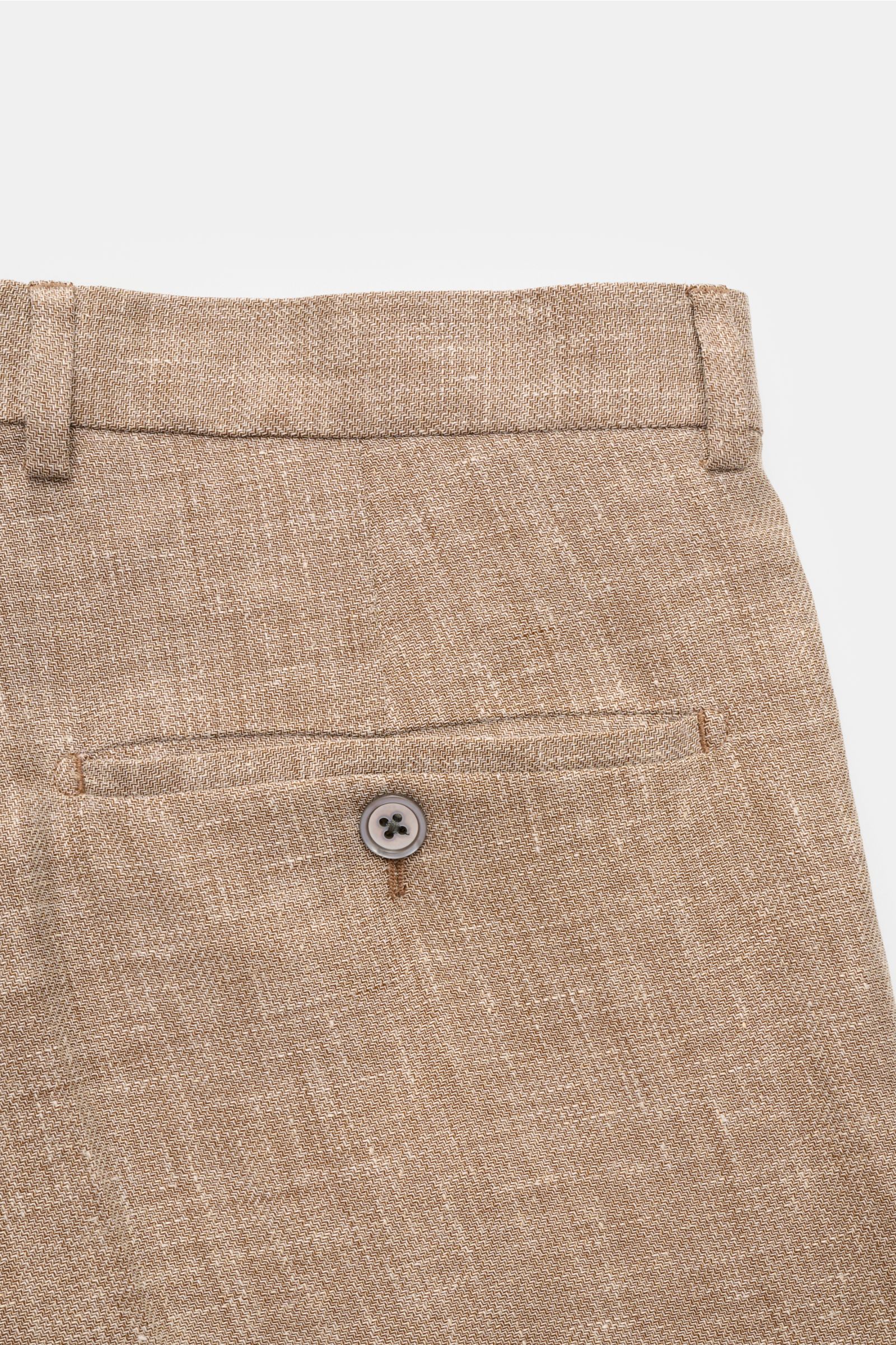 Close-up rear view of Windsor Trousers 'Silvi' brown/cream melange, showcasing back pocket with button on distinctive linen, wool, and silk blend fabric.

The 'Silvi' model from WINDSOR are the perfect lightweight summer trousers in a distinctive fabri