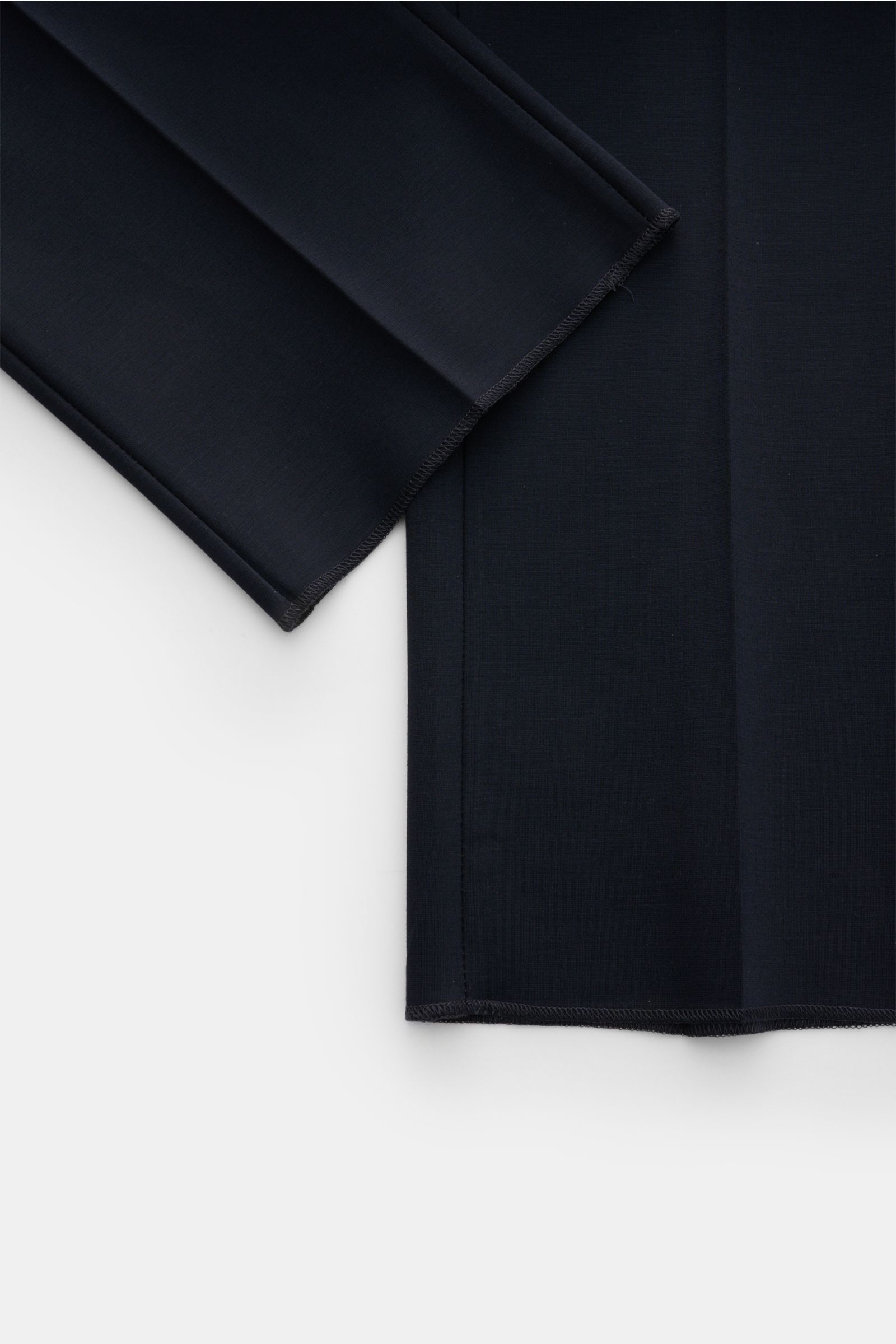 Close-up front view of the navy GTA Jersey trousers 'Federico' showing the open hem and single pleat, jersey material with elastic waistband. For casual office looks: The jersey trousers 'Federico' by GTA combine maximum comfort with timeless elegance to 
