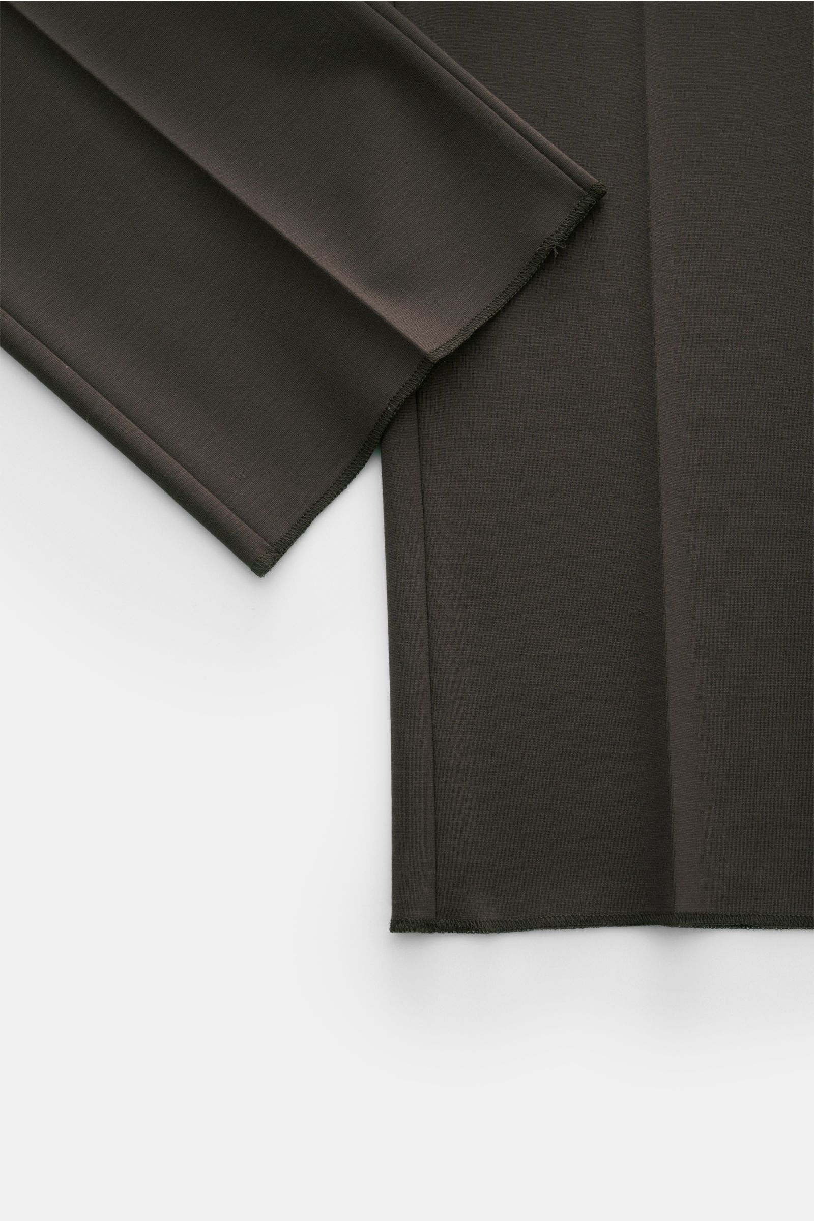 GTA Jersey trousers 'Federico' dark brown shown from a close-up top-down view, highlighting the open hems and smooth jersey fabric. For casual office looks: The jersey trousers 'Federico' by GTA combine maximum comfort with timeless elegance to make a ver