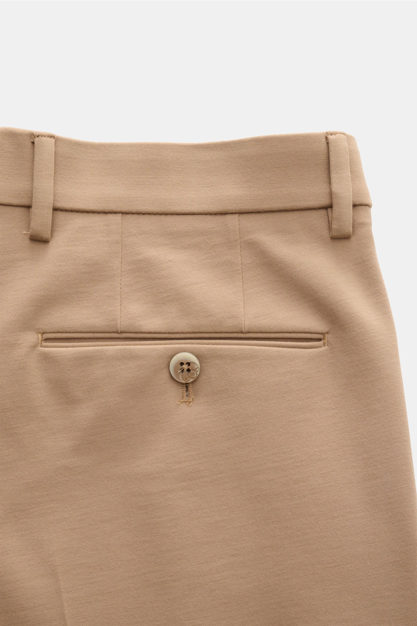 GTA Jersey trousers 'Federico' beige shown from the back close-up, featuring single pleat, jetted back pockets with button, elastic waistband, and soft jersey fabric. For casual office looks: The jersey trousers 'Federico' by GTA combine maximum comfort w