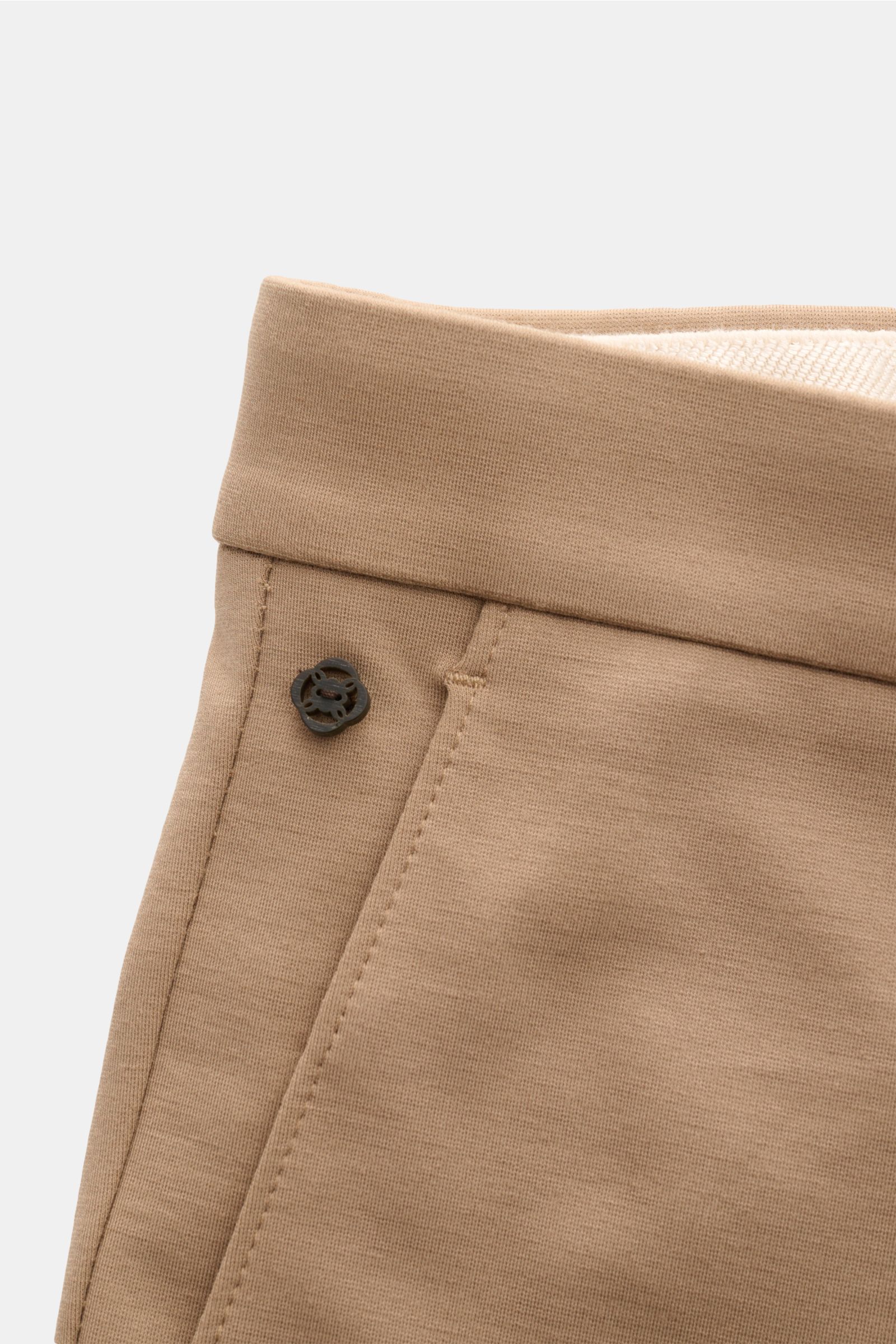 Close-up front side view of GTA Jersey trousers 'Federico' beige, showing elasticated waistband, single pleat, and button detail. For casual office looks: The jersey trousers 'Federico' by GTA combine maximum comfort with timeless elegance to make a versa