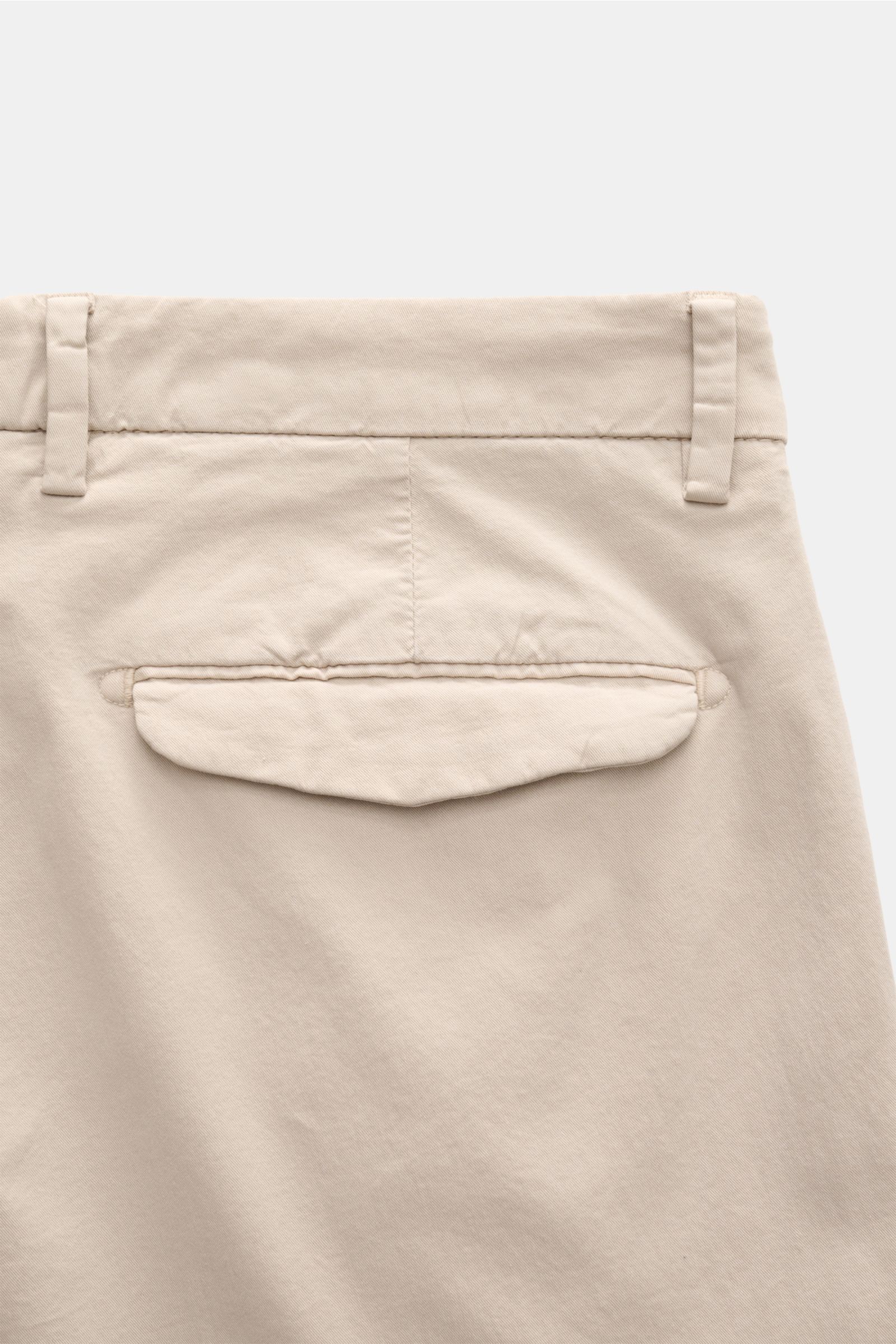 Close-up back view of Briglia 1949 Chinos beige, showing elasticated waistband, back pocket with flap, and soft Tencel cotton twill fabric.

Maximum comfort meets an elegant silhouette: Summery ease meets timeless aesthetic in these chinos by BRIGLIA 1