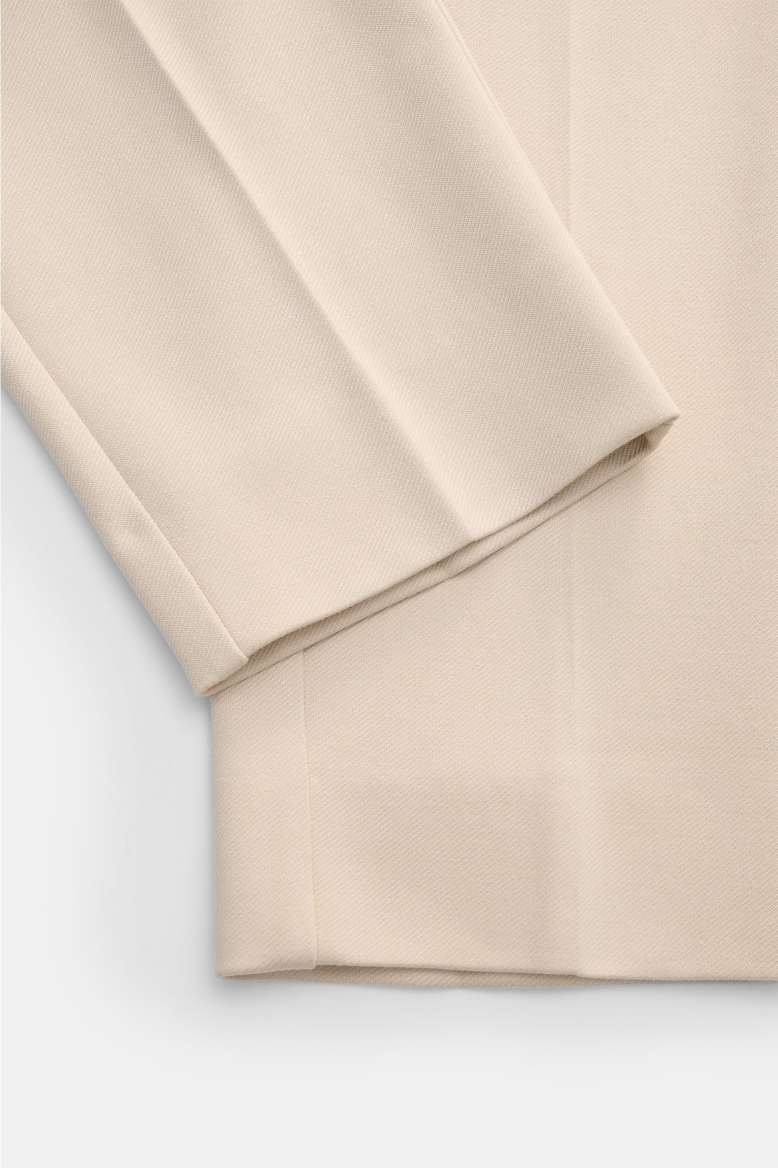 Close-up front view of Kiefermann Jersey trousers 'Hunfrid' sand showing ankle length, slim fit, elastic waistband, and distinctive twill look fabric. Experience comfort all day long: The jersey trousers 'Hunfrid' by KIEFERMANN combine elegant design with