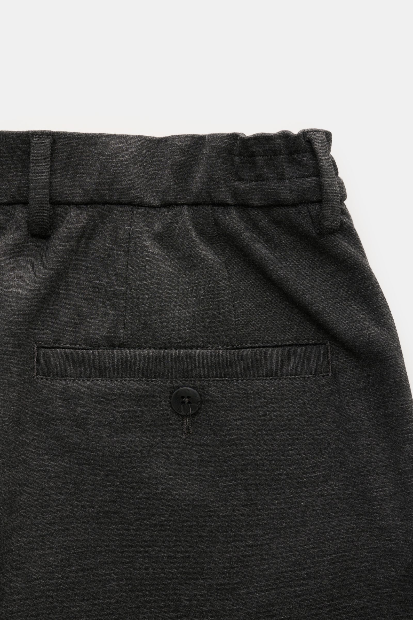 Close-up rear view of GTA Jogger pants 'Dennis' dark grey mottled showing buttoned back pocket, elasticated waistband, and soft smooth viscose blend fabric.